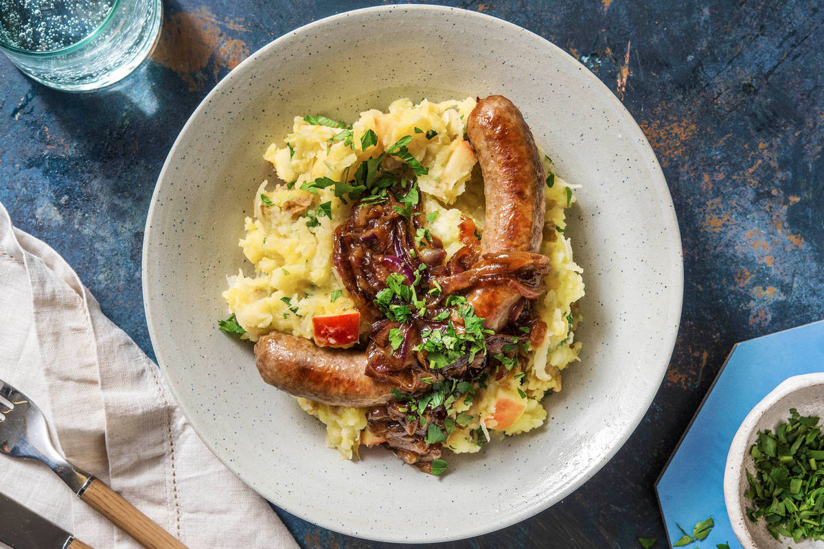 Saucisse de porc à l'estragon et purée de pommes de terre et de choucroute