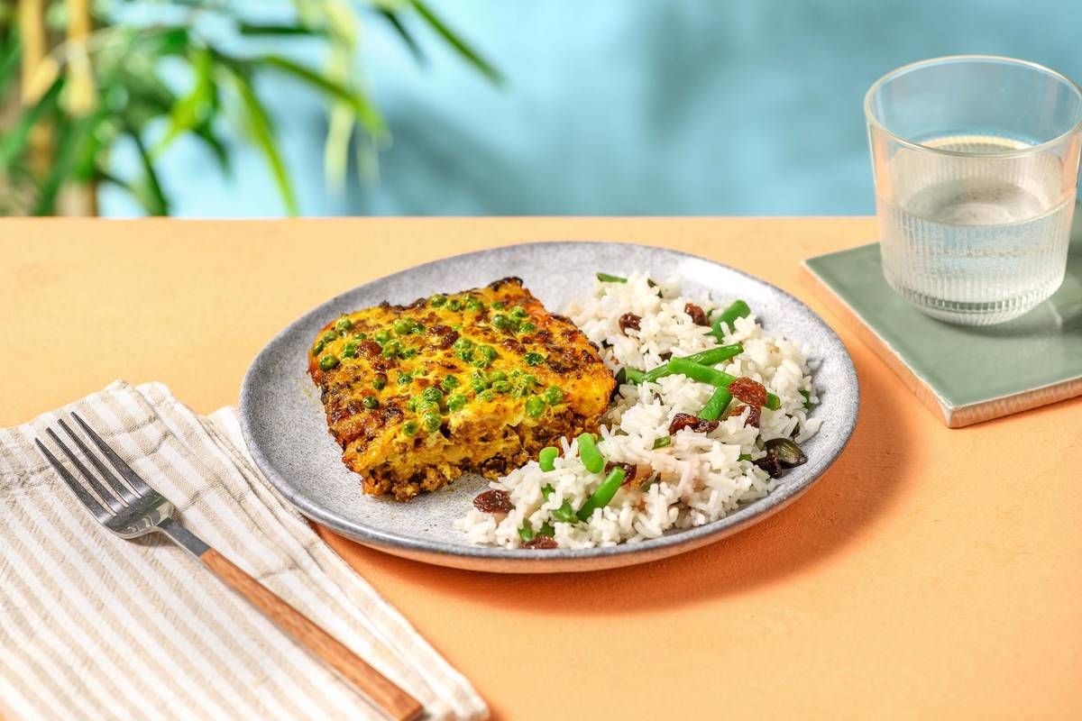 Bobotie avec du riz des raisins secs et un mélange de graines