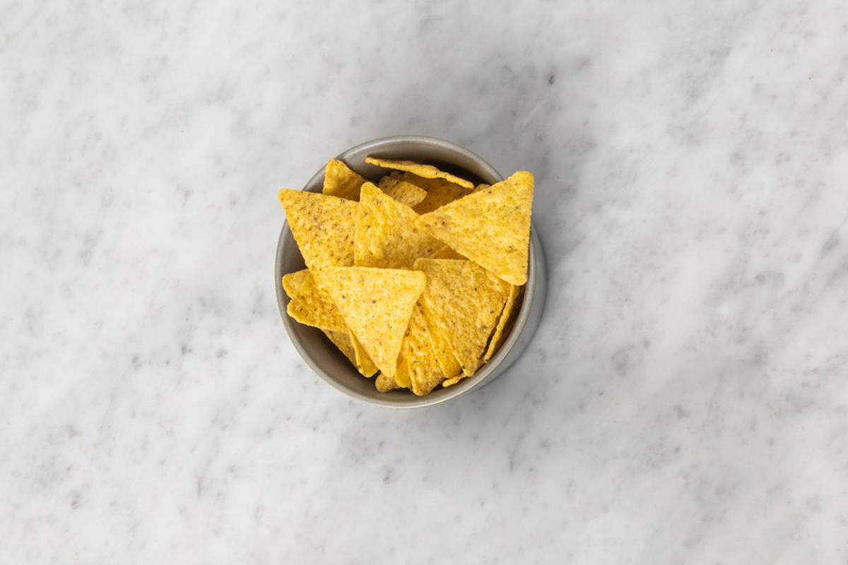 Pittige tortillachips als extra
