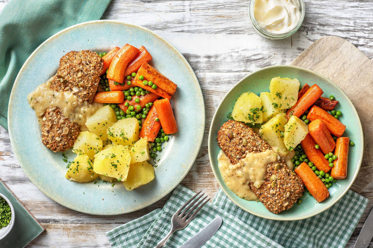 Meerzadenvisschnitzel met doperwten en worteltjes