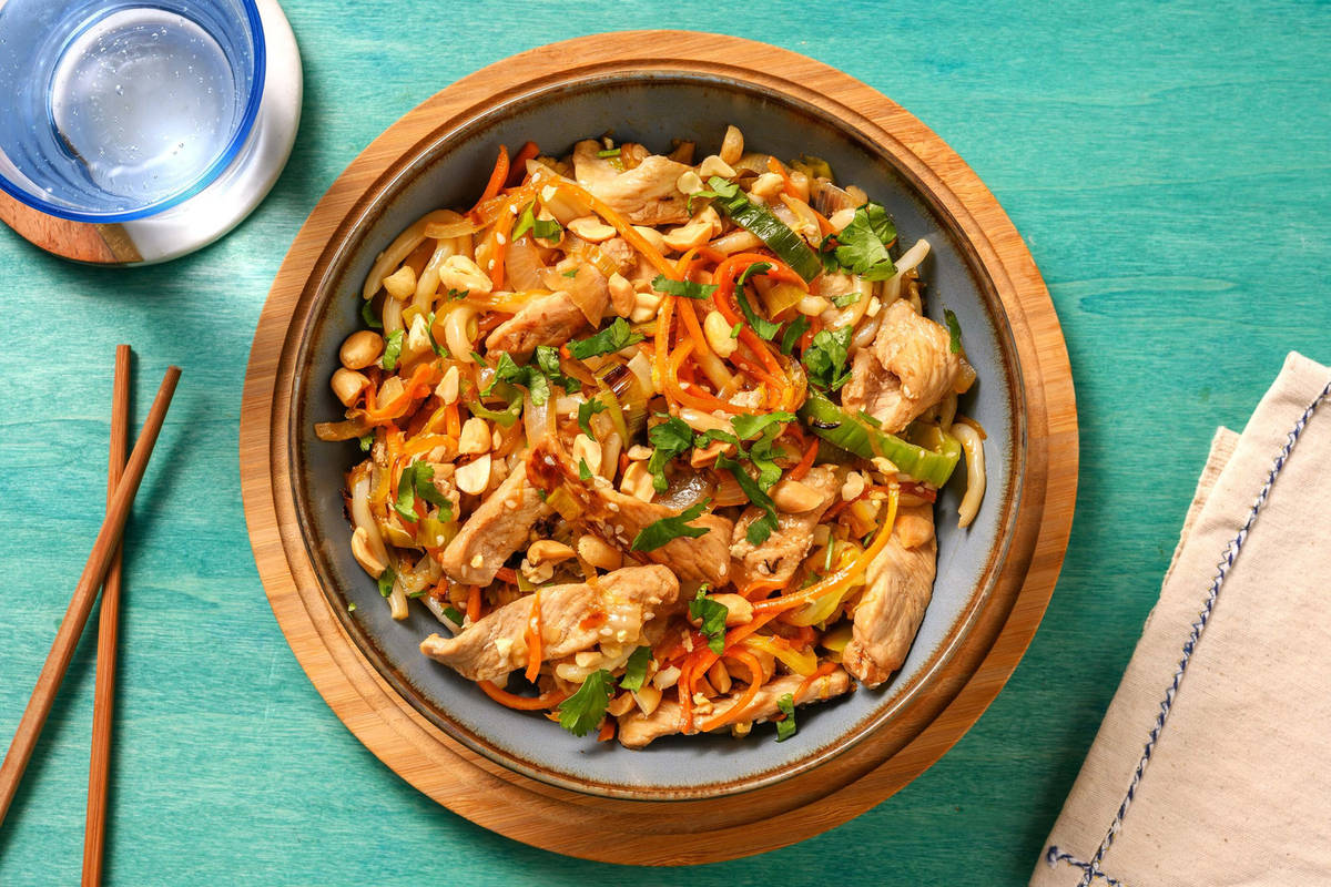 Wok de nouilles udon aux émincés de porc