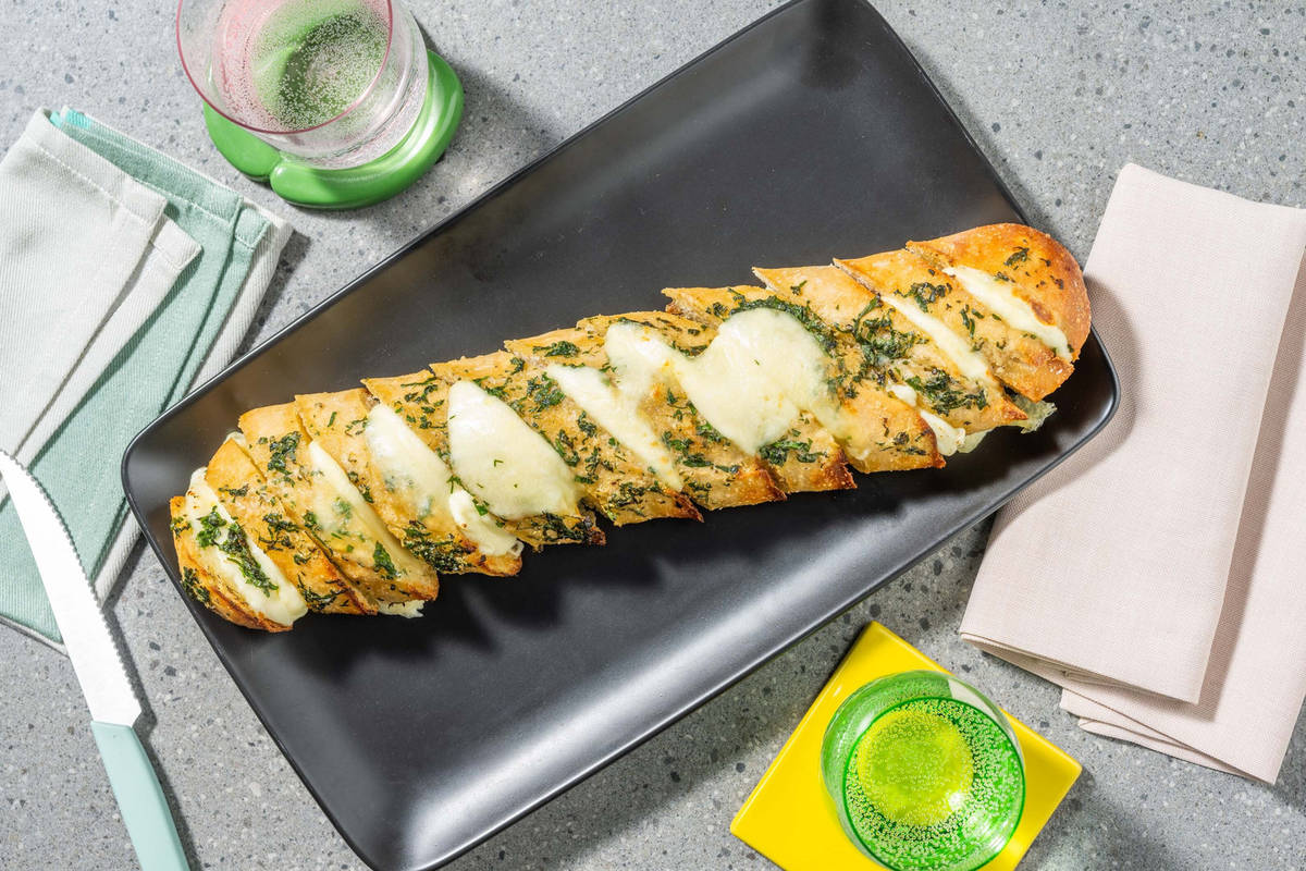 Cheesy Herby Hasselback Garlic Baguette