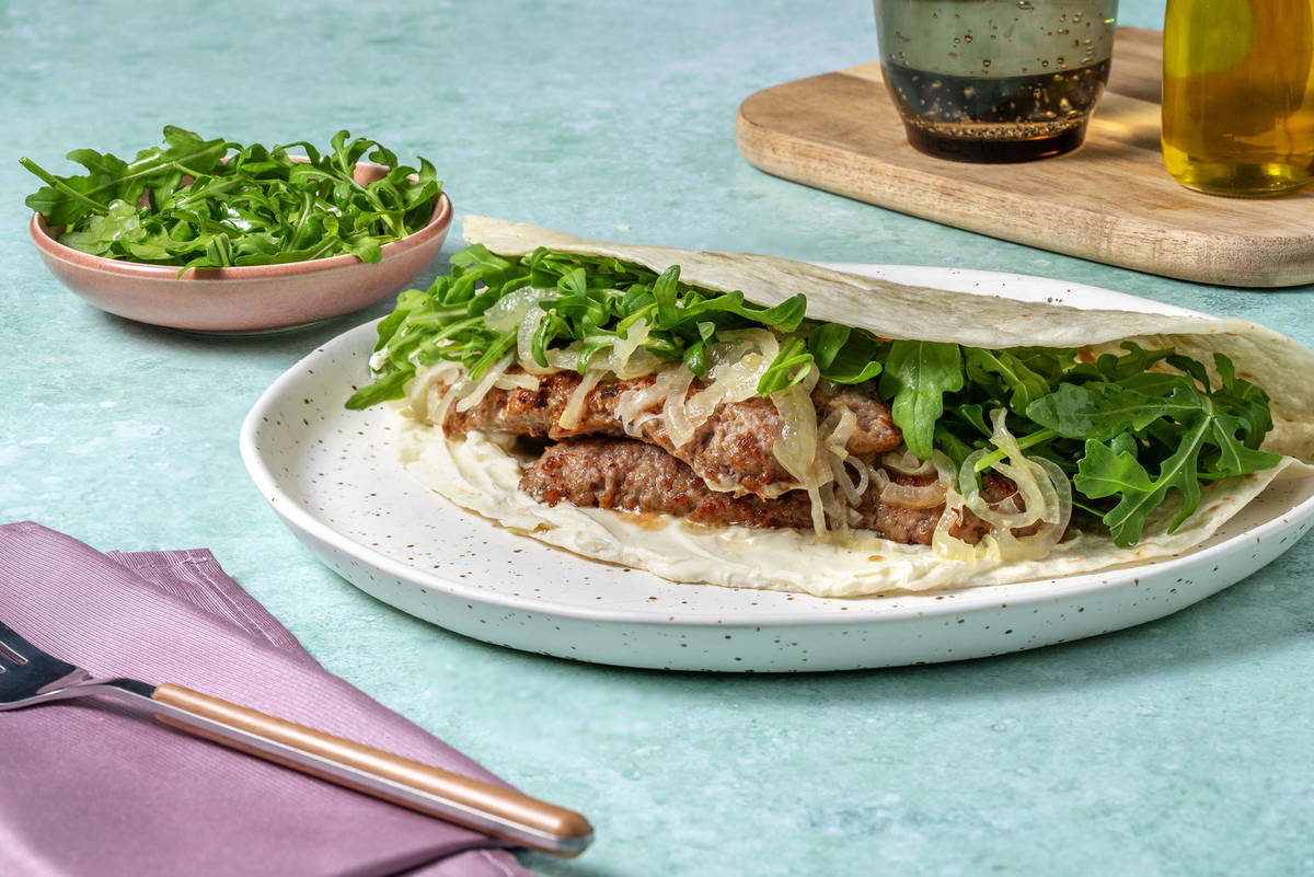 Piadina romagnola salsiccia, rucola e cipolle