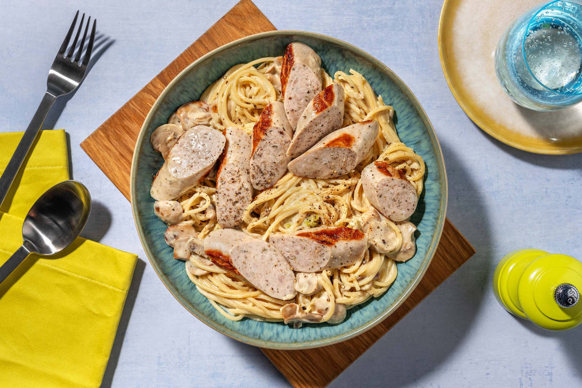 Spaghetti met gekruide kipworst en pesto-roomsaus