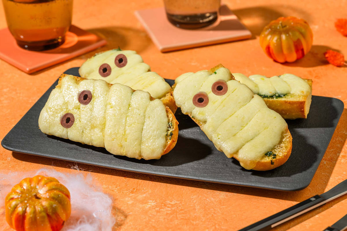 Ghoulish Garlic Baguette Mummies
