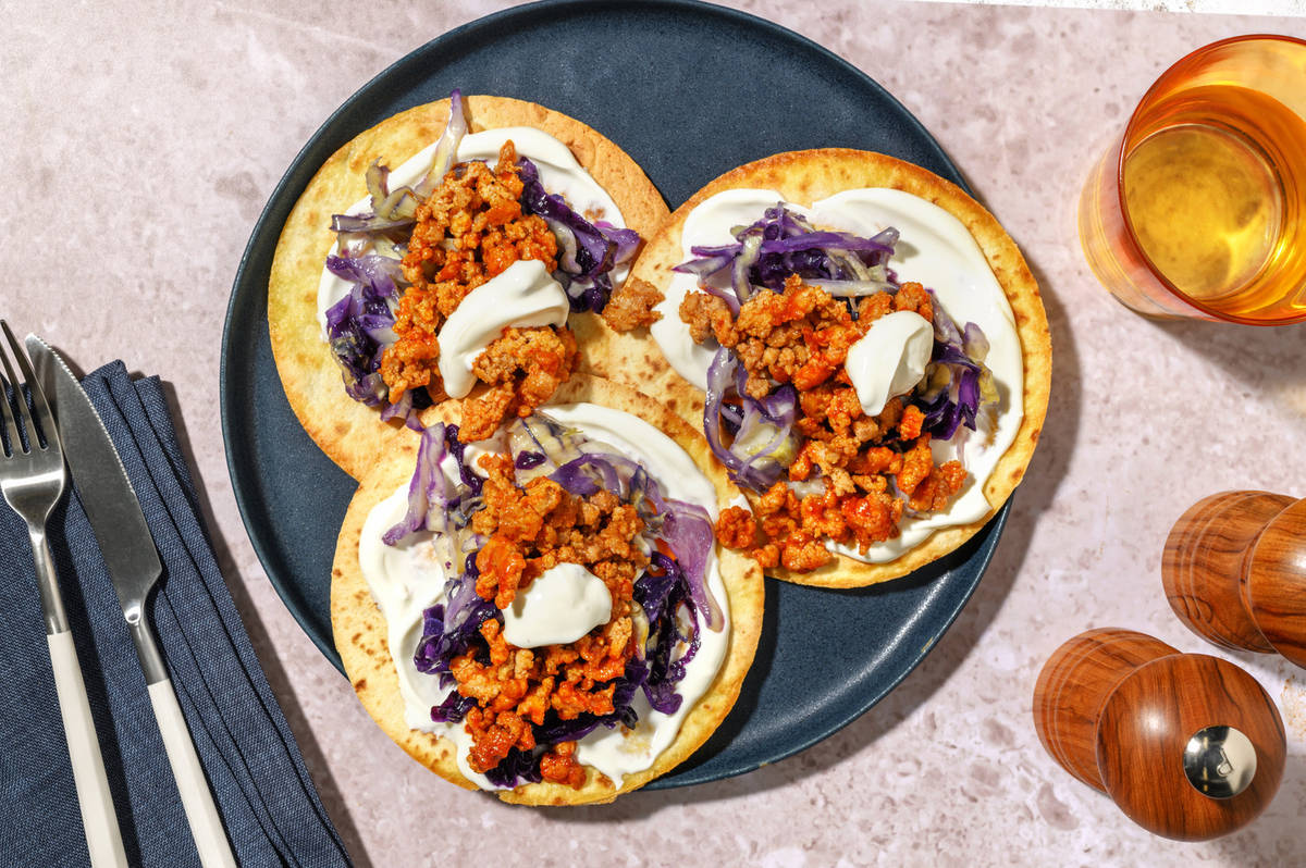 Tostadas speziate di maiale e salsa yogurt