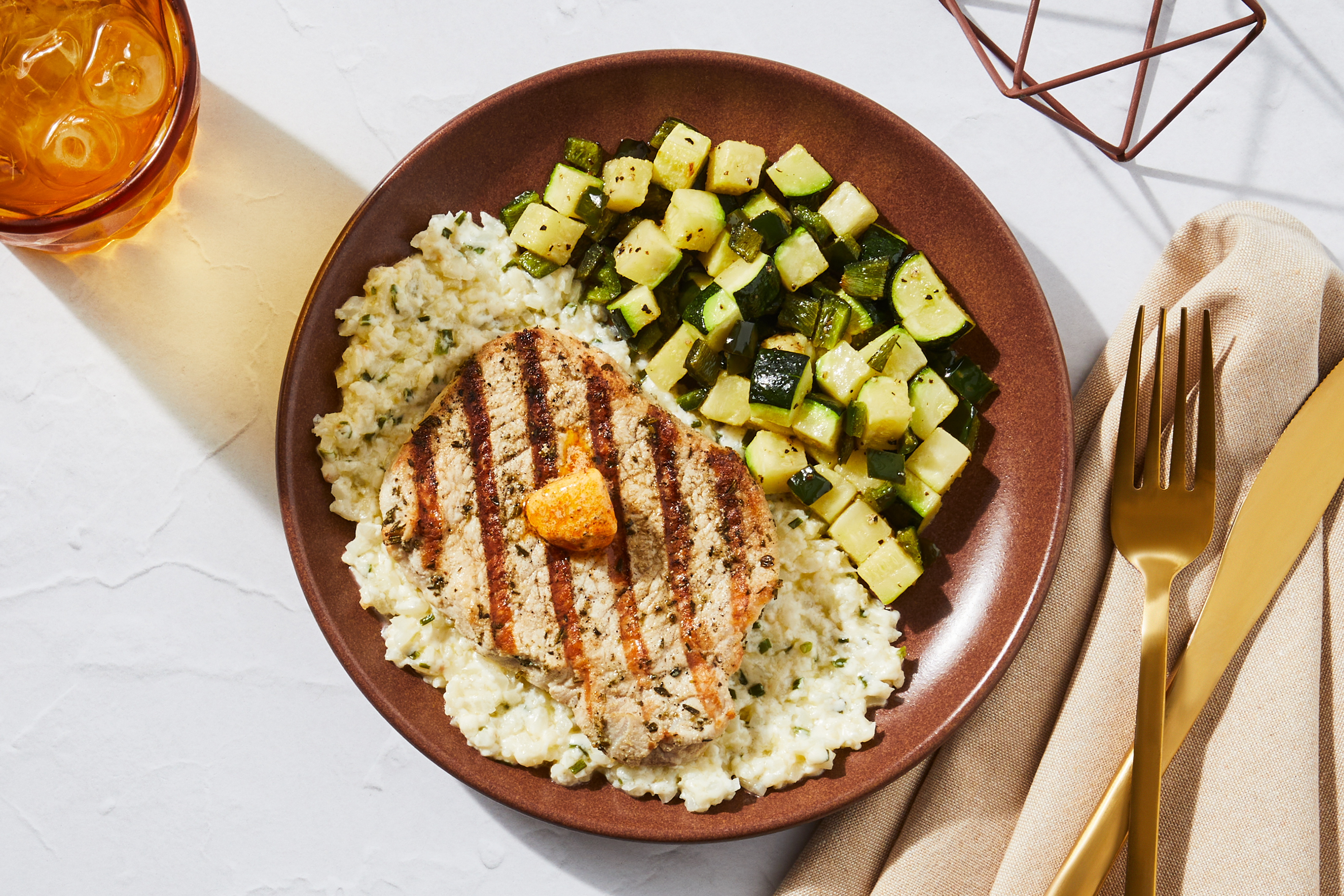 Grilled Pork Chop & Smoked Cheddar Cauli Grits