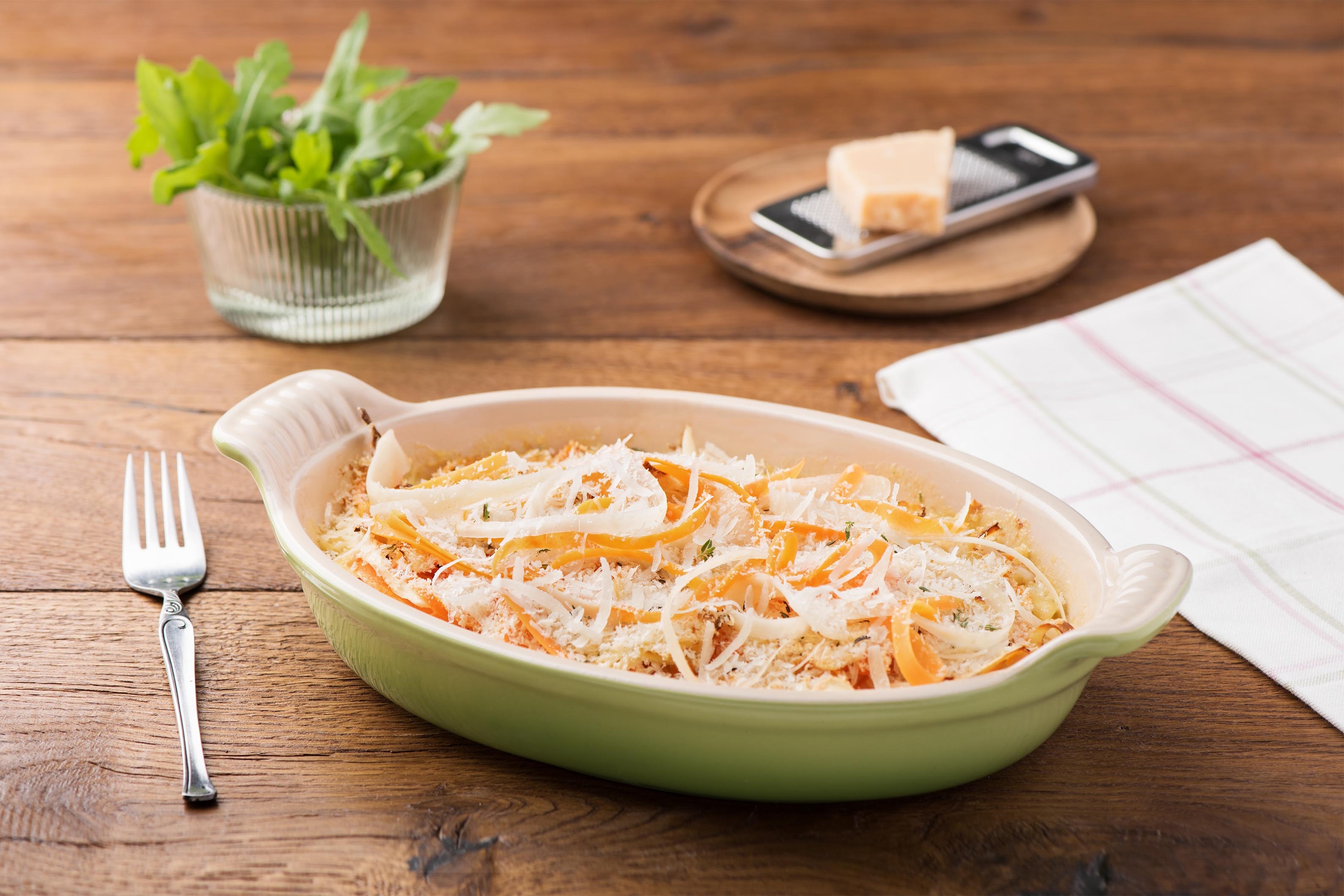 Parsnip and Carrot Gratin with Gruyere Mornay and Greens