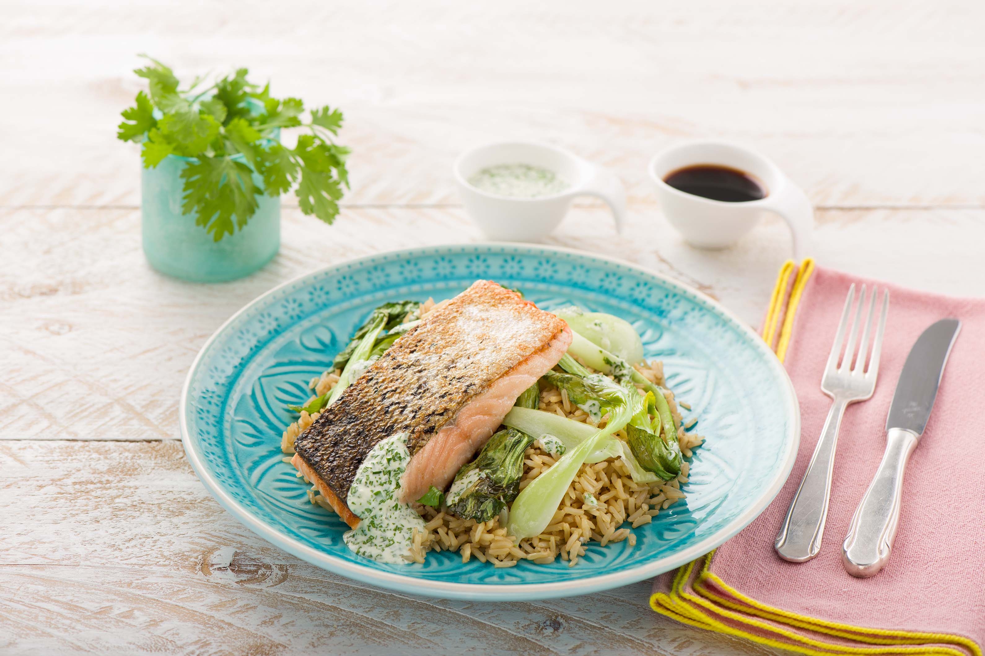 Crispy Pan-Seared Salmon with Baby Bok Choy, Cilantro-Wasabi Dressing, and Soy-Infused Brown Rice