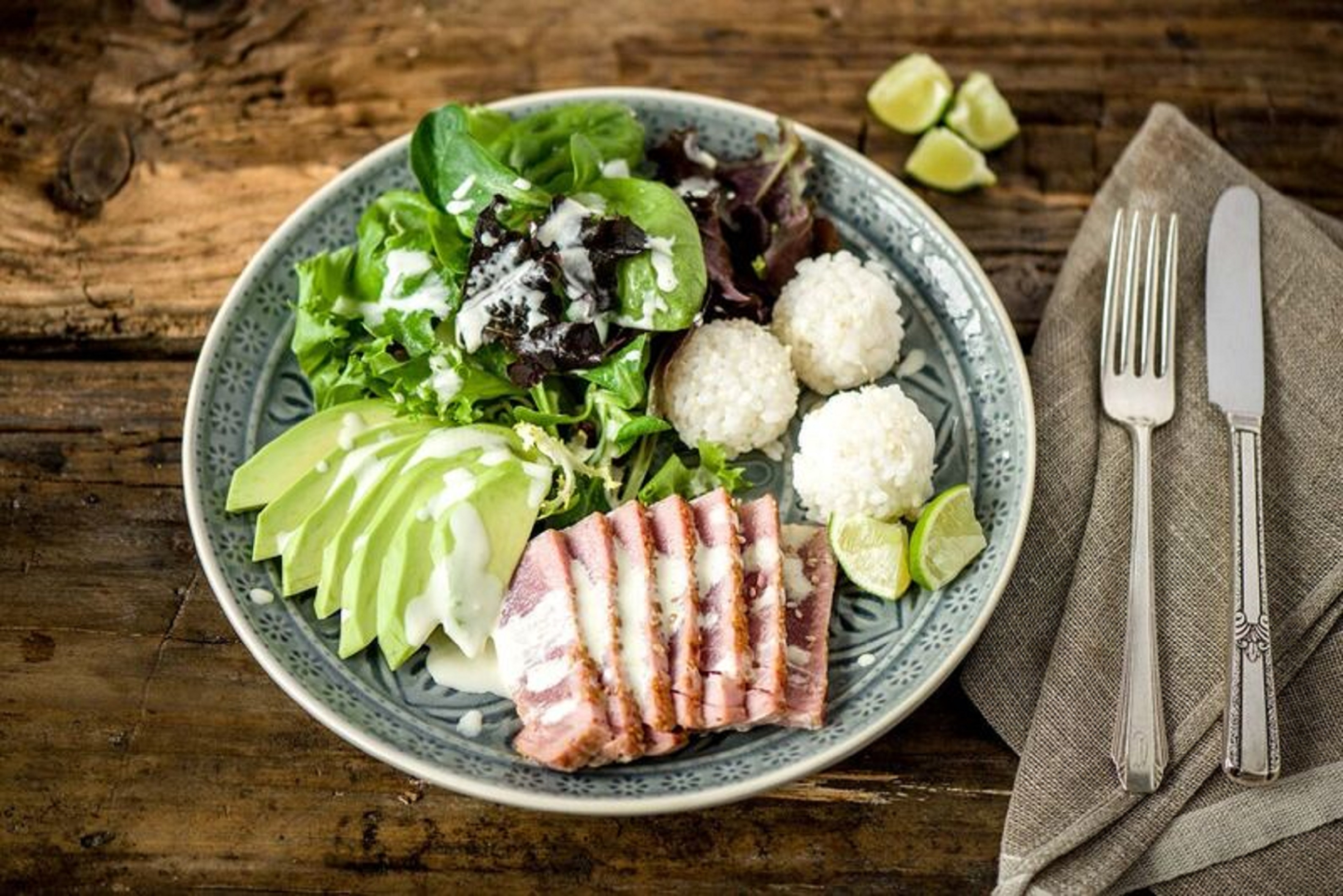 Sesame-Crusted Tuna Tataki Salad with Rice Balls, Avocado, and Wasabi-Lime Dressing