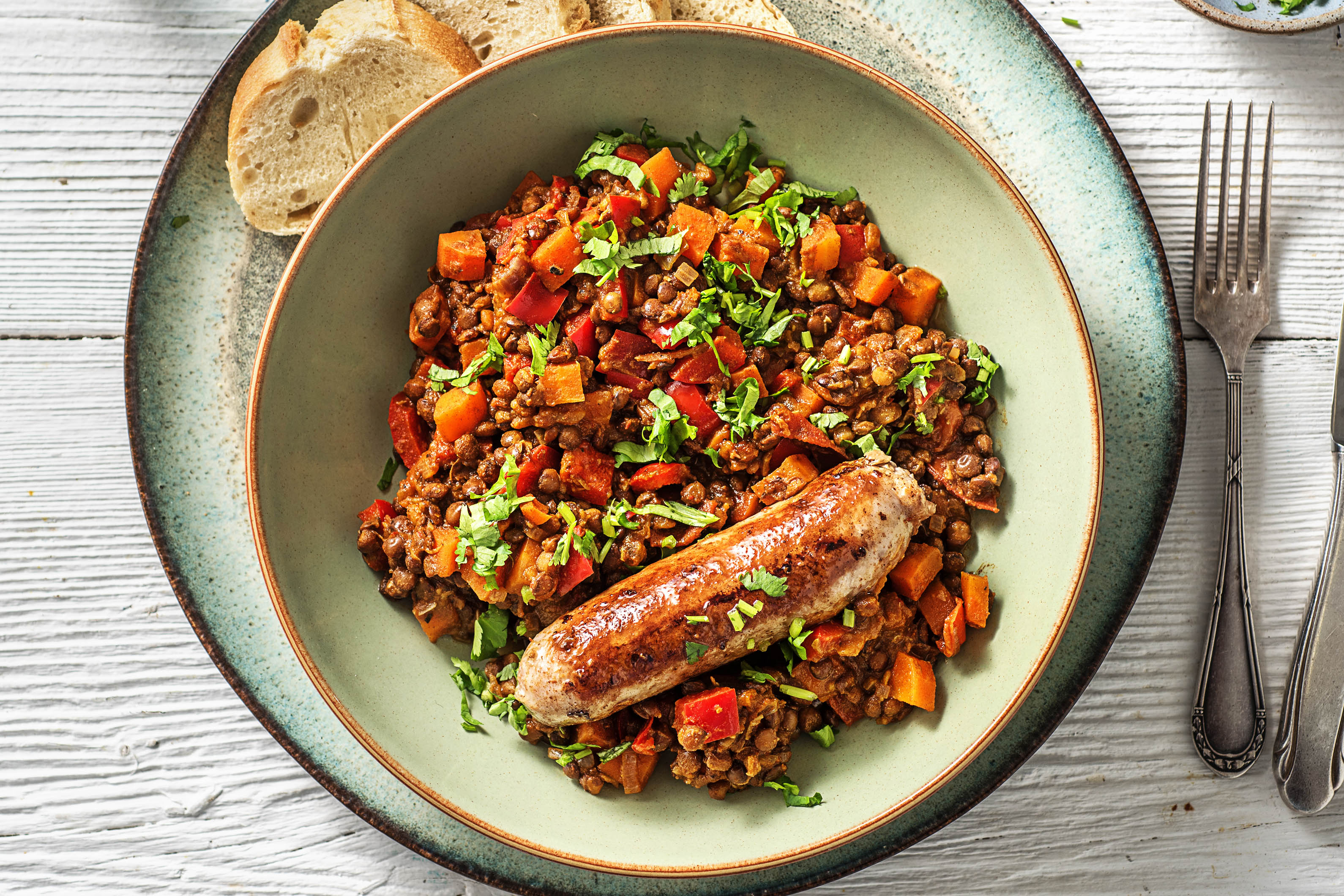 Mijoté de lentilles légèrement piquant et merguez de bœuf