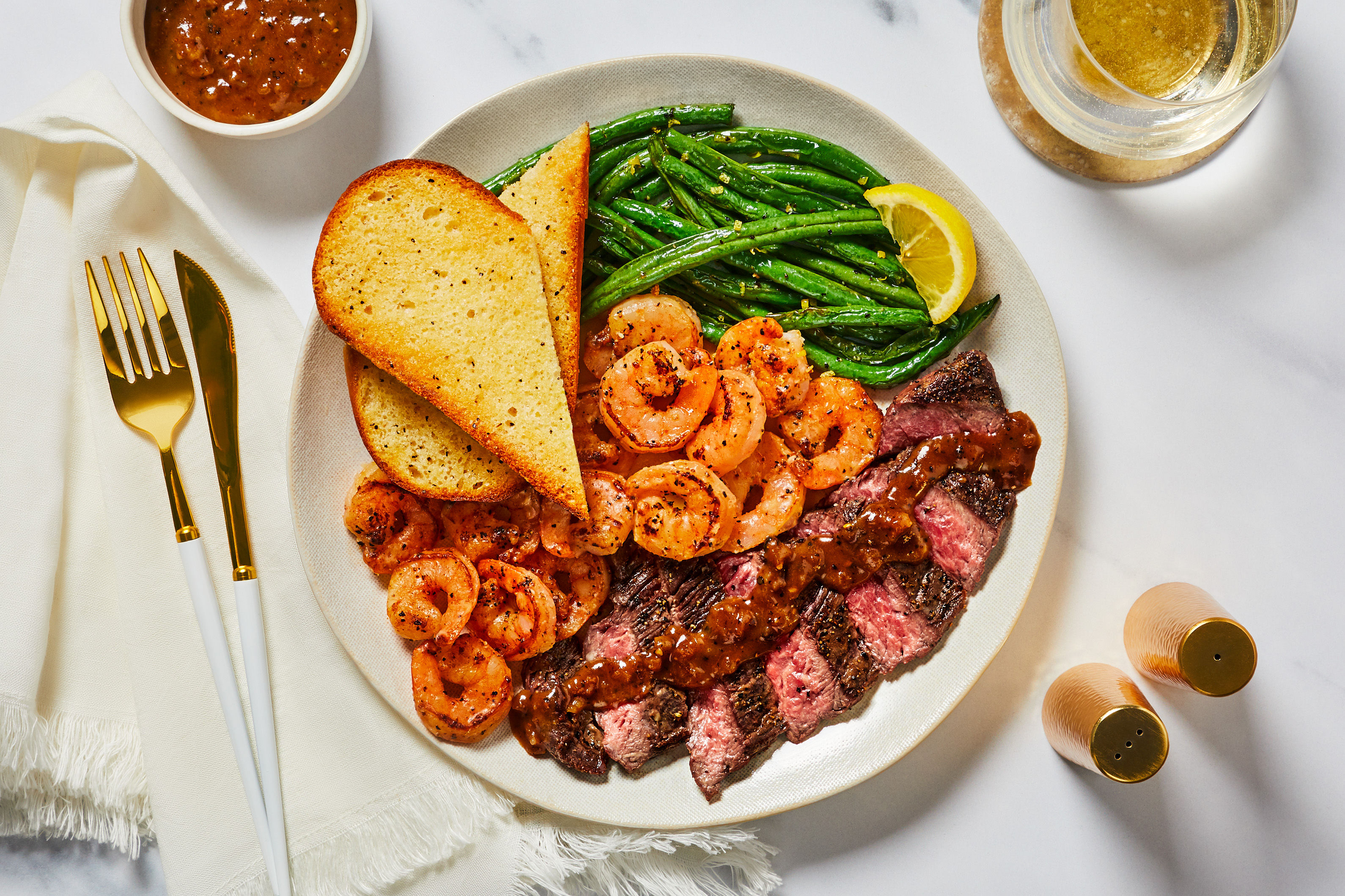 Steak au Poivre & Garlic Herb Shrimp