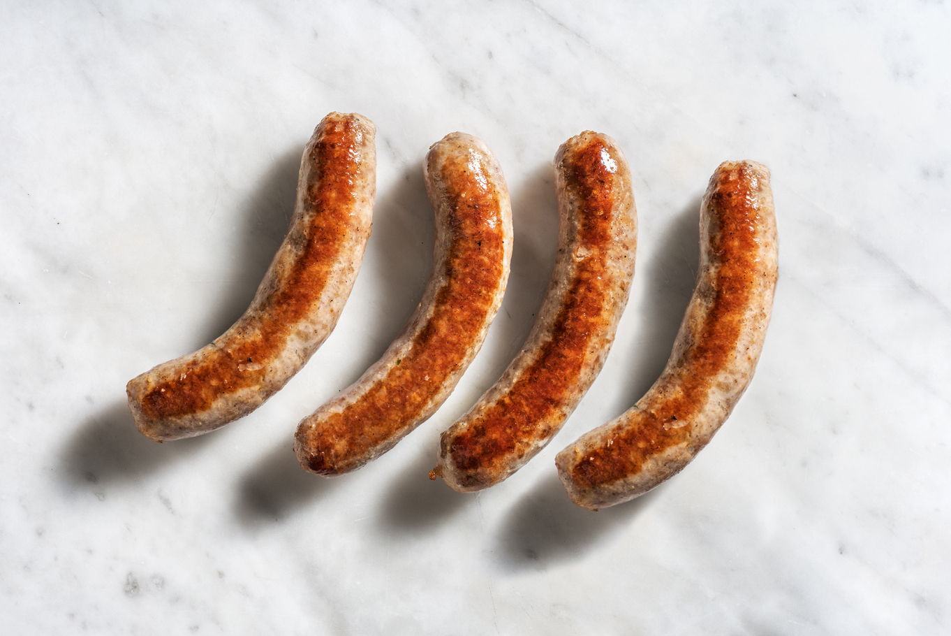 Saucisses de porc à la tomate et au romarin en extra