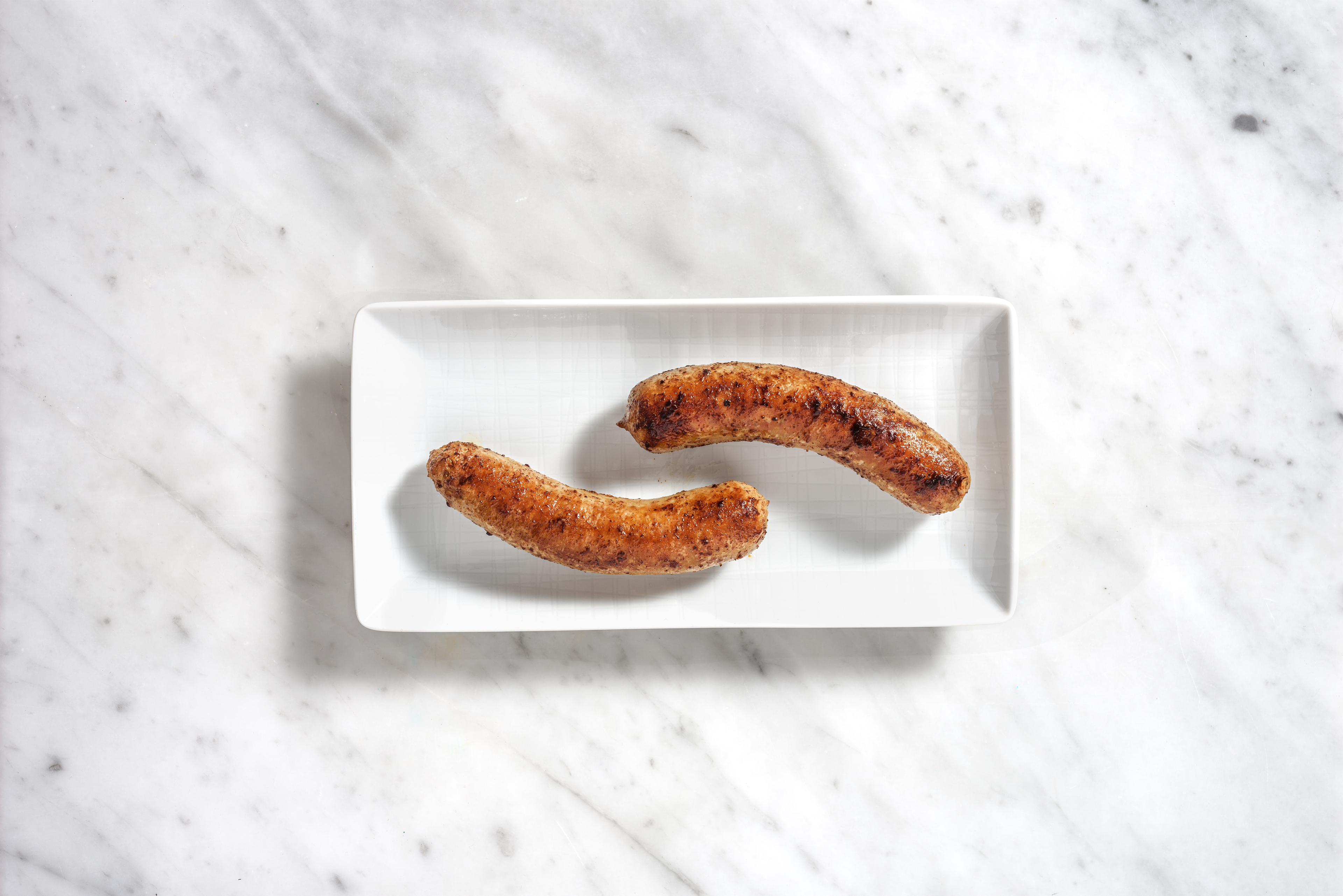 Saucisse de porc, marjolaine et ail en extra