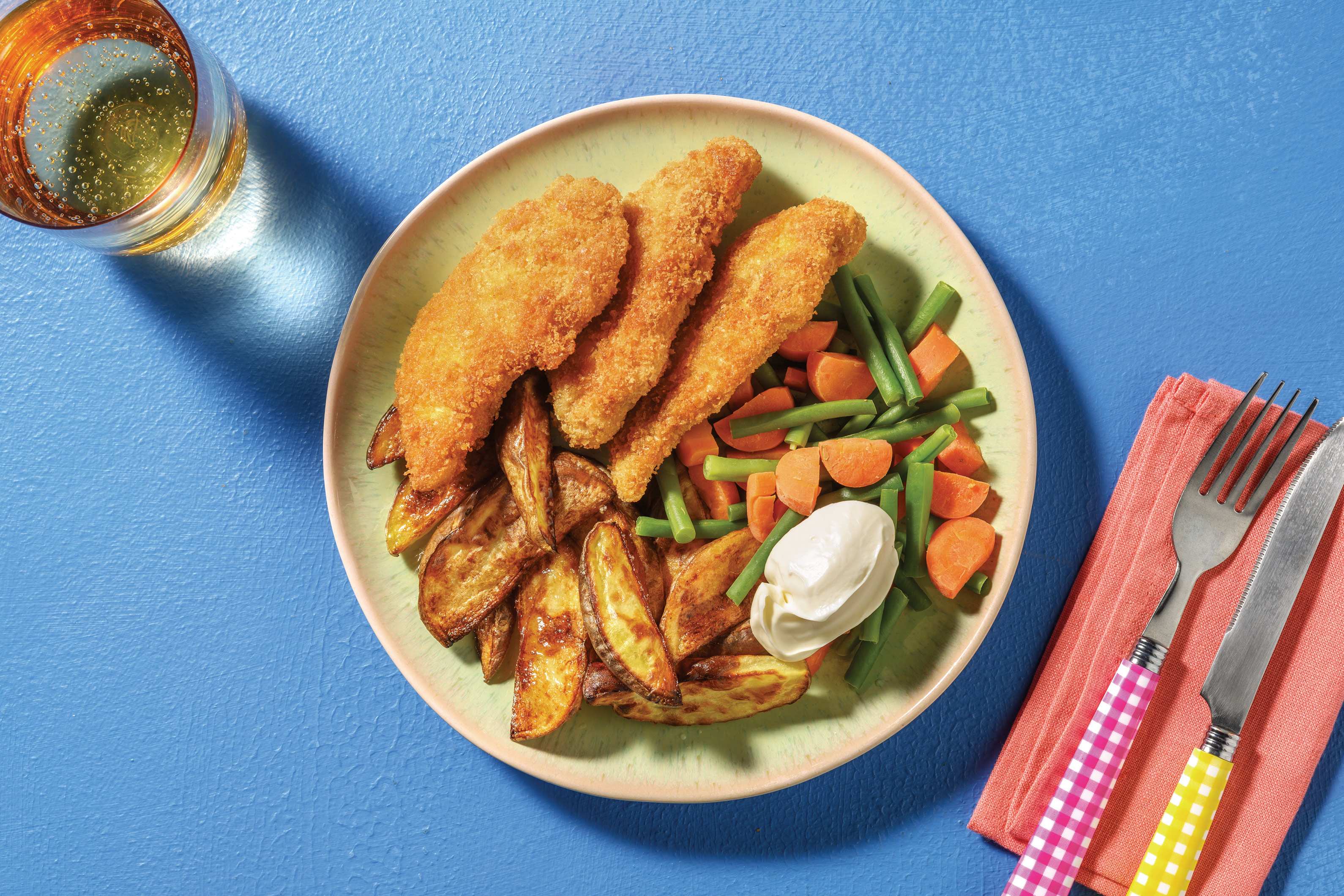 Crumbed Chicken Strips with Potato Wedges & Steamed Veggies