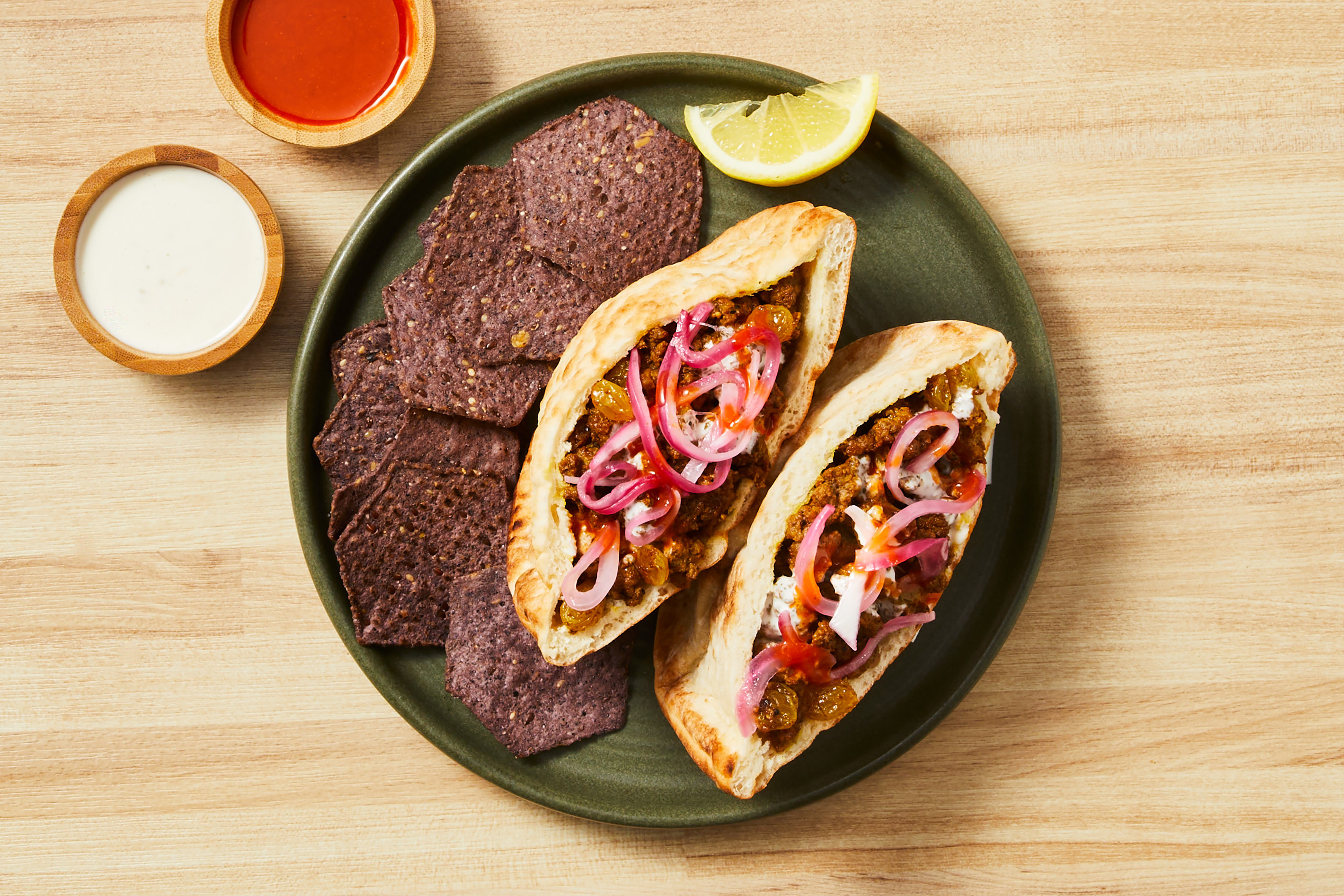 Shawarma-Spiced Tofu & Golden Raisin Pitas
