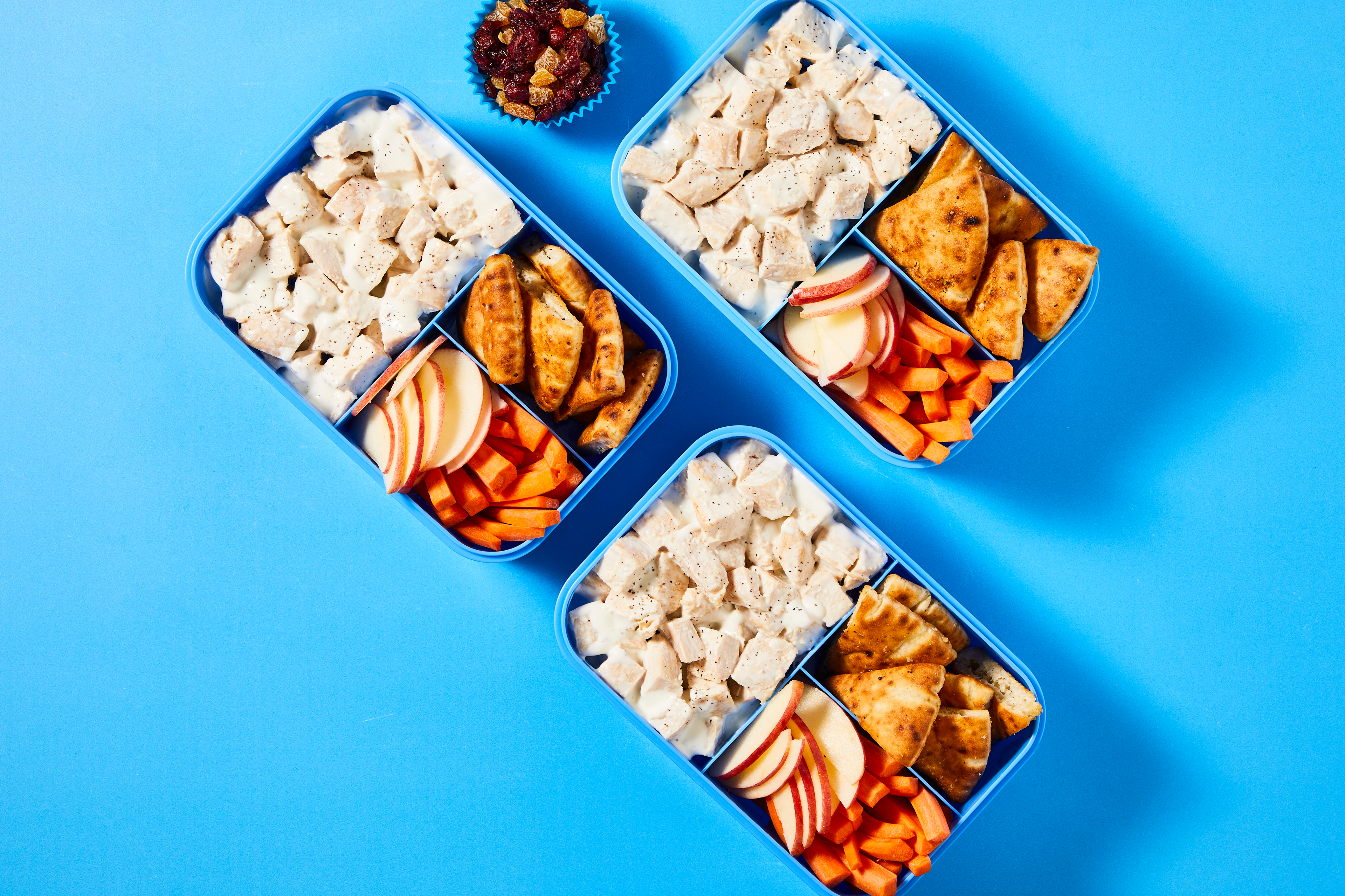 Kid's Lunch A&E Chicken Salad with garlic pita chips, trail mix, carrots, and apple