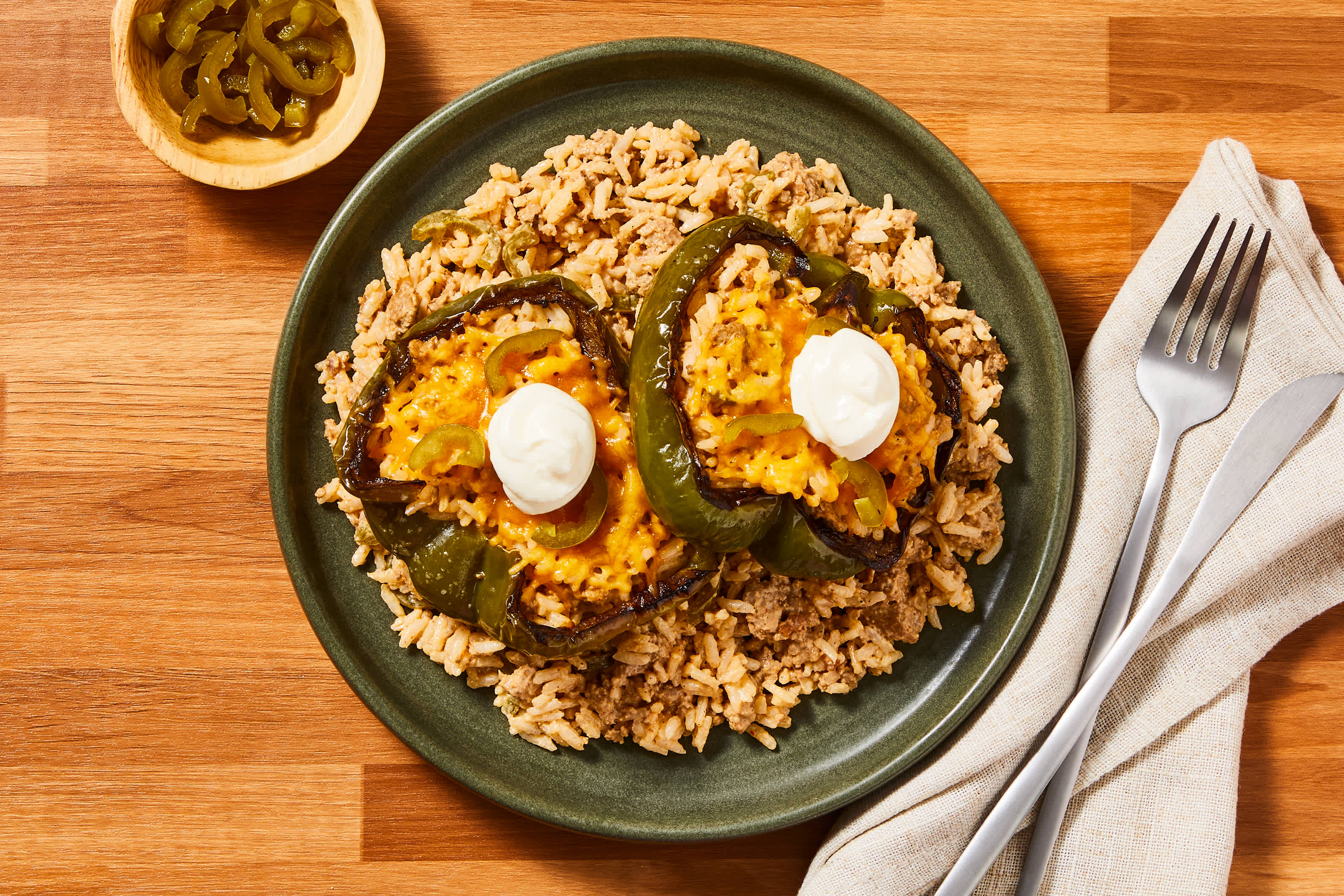 [SIDE VEG DOUBLE GREEN BELL PEPPER] Pork & Pickled Jalapeno Popper Stuffed Peppers with Cheddar & Dollops of Sour Cream