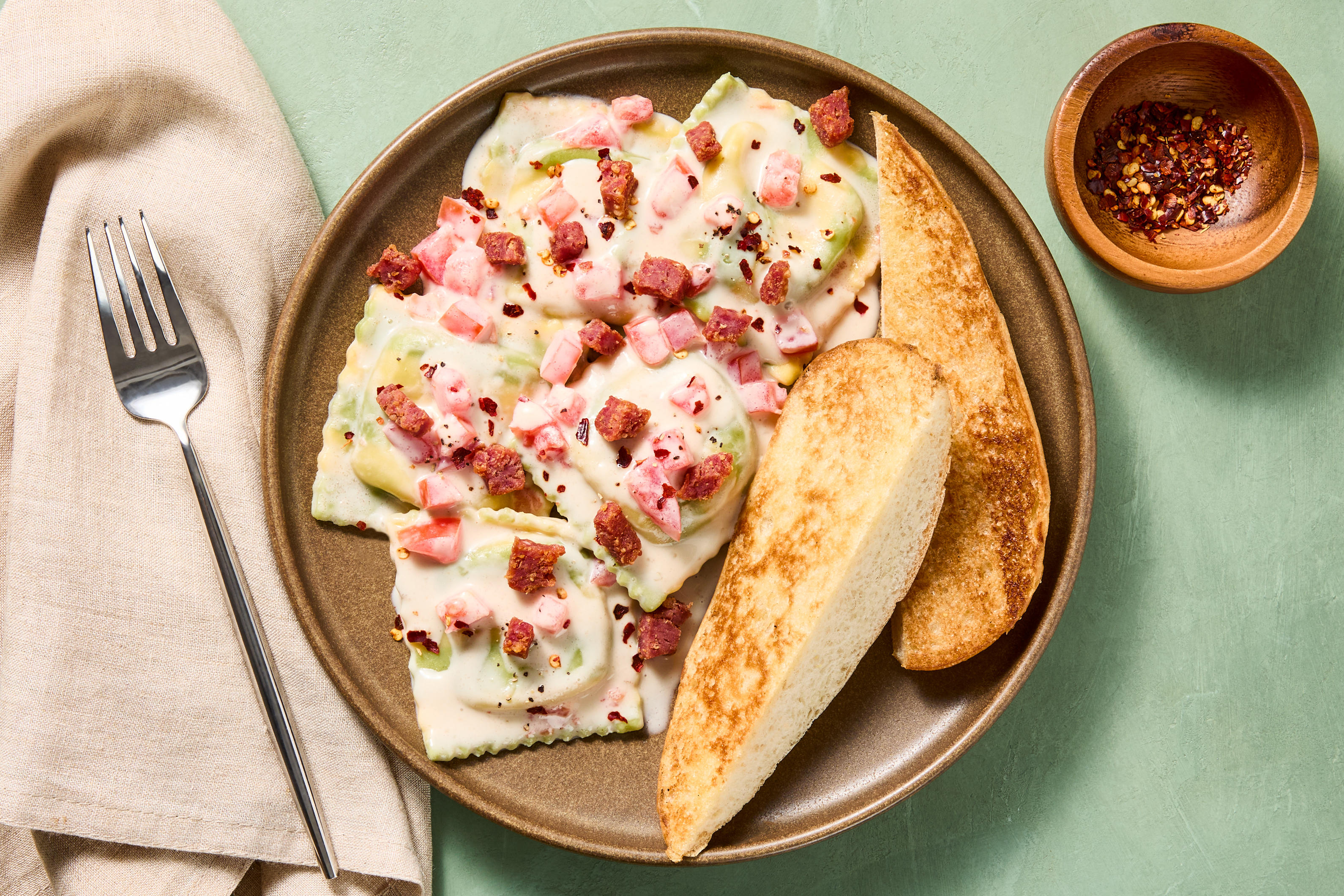 Spinach Ravioli with Crispy Salami