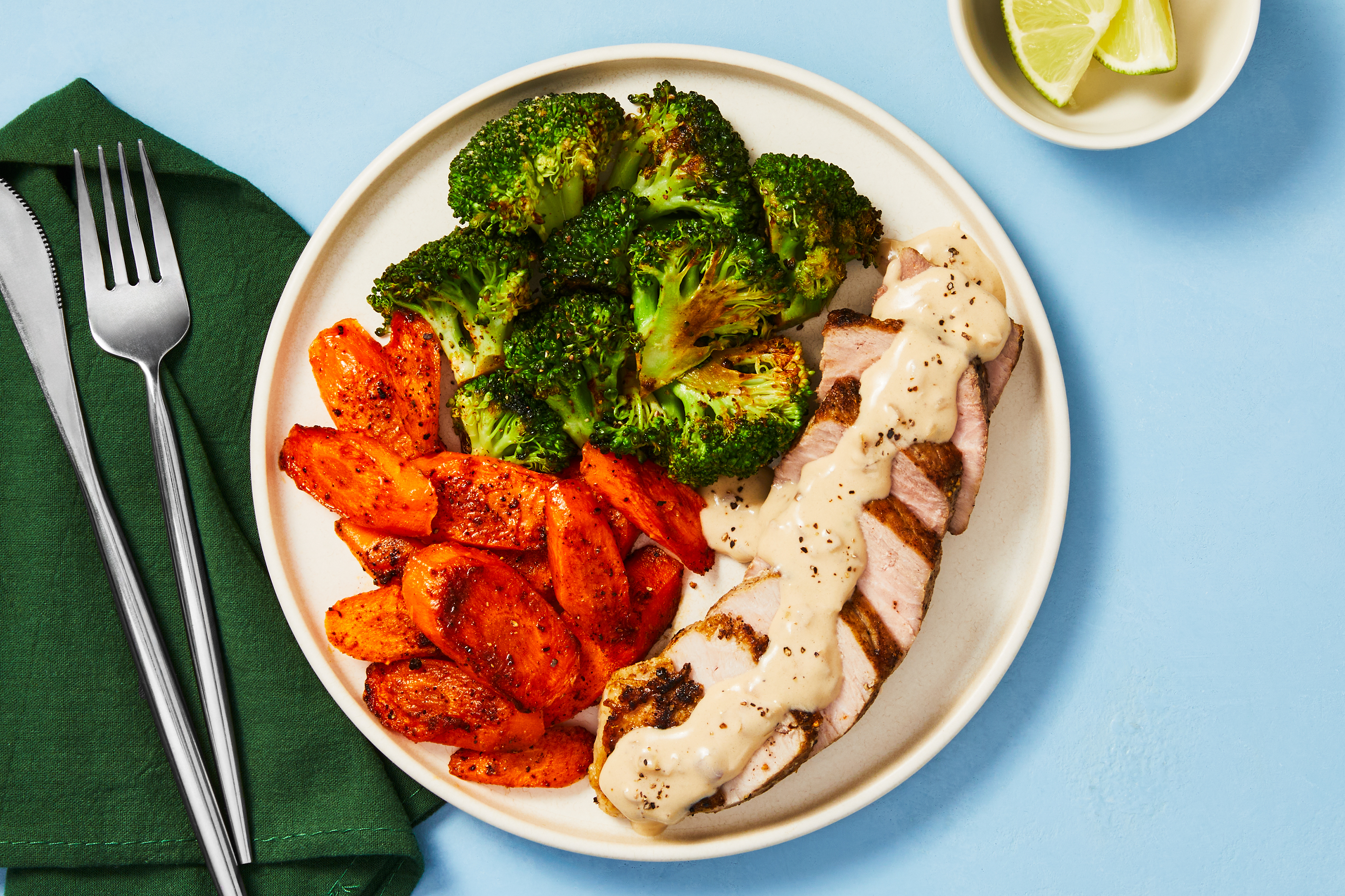 [SIDE VEG DOUBLE BROCCOLI] Cuban Pork Chops with Creamy Pan Sauce and Chipotle Lime Broccoli & Carrots