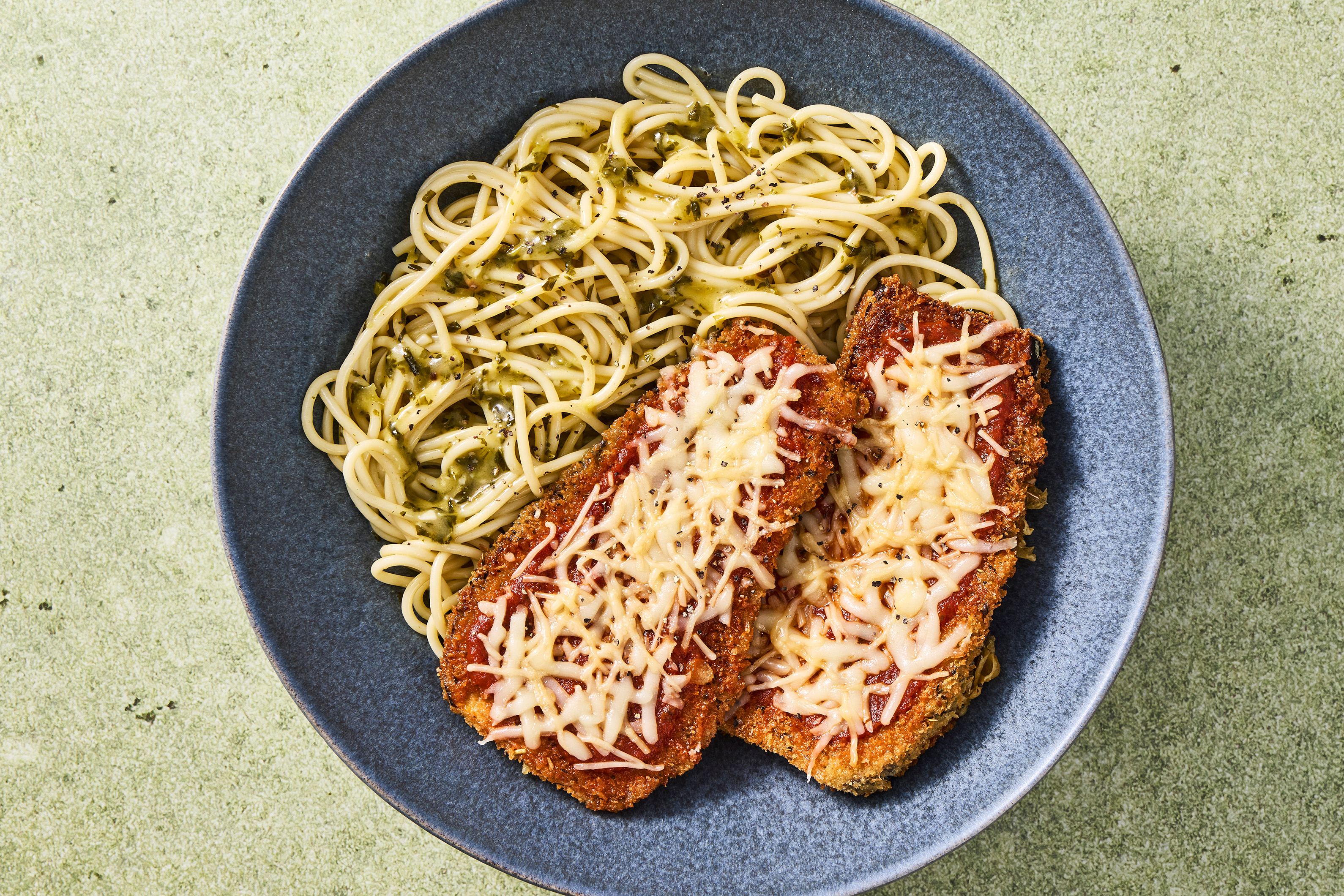 Eggplant Parmesan over Pesto Spaghetti