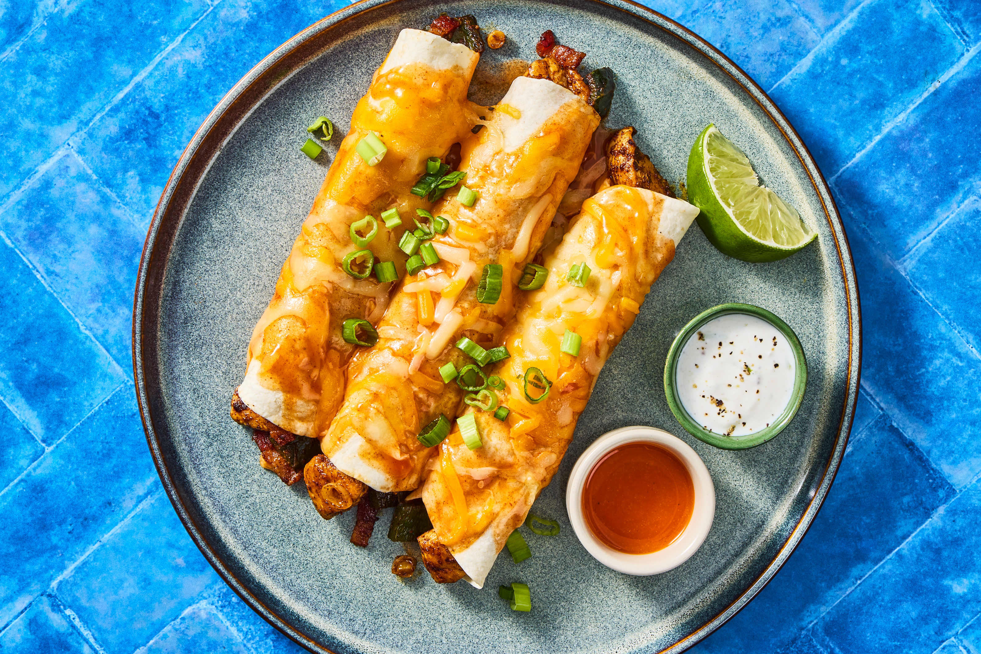 MA/CA only Compliant Chicken, Pepper, & Bacon Enchiladas with Lime Crema and Scallions