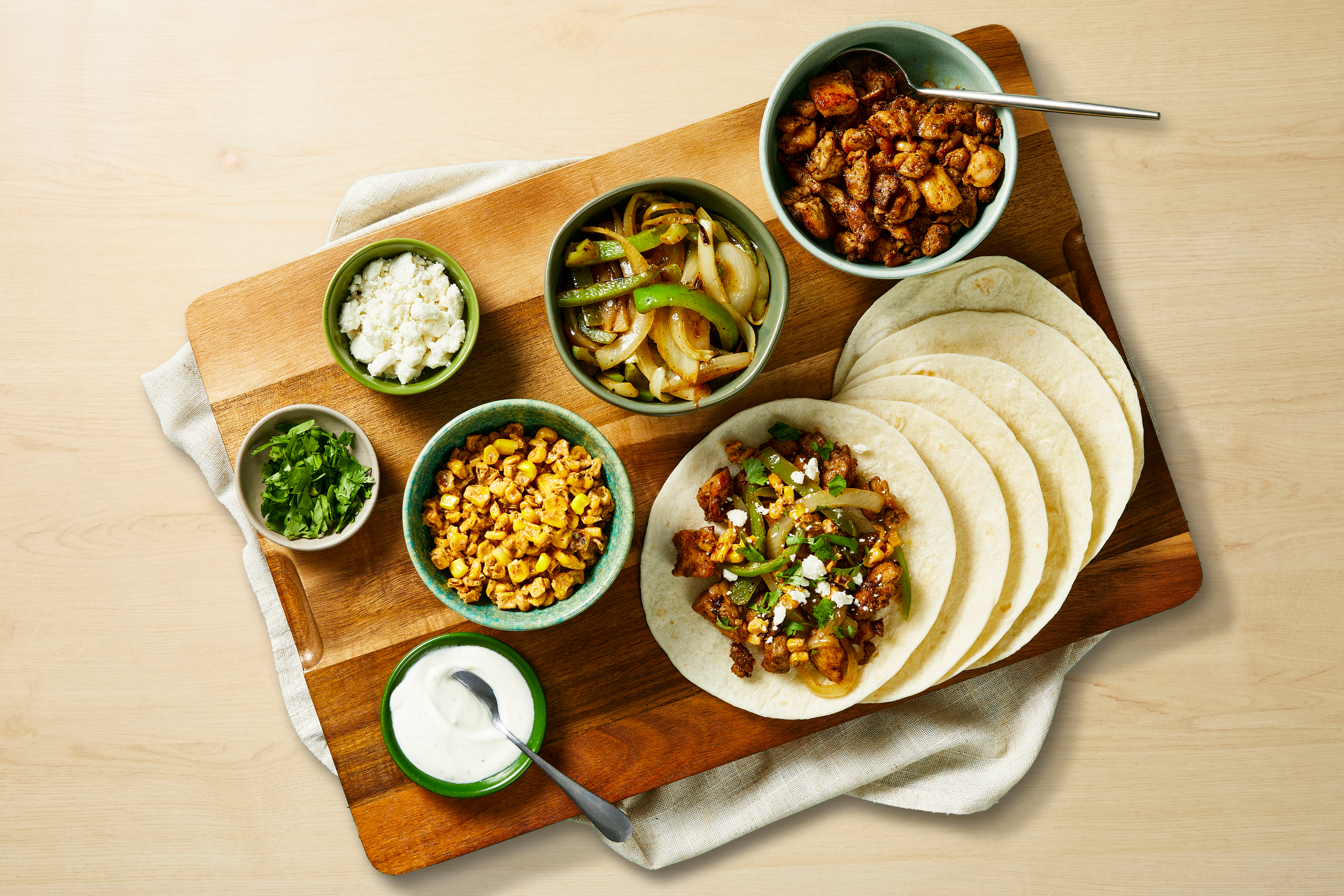 [SIDE ADD BLUE CORN TORTILLA CHIPS] BYOP Chicken Taco Bar with Onions & Peppers, Charred Corn Salad & Lime Crema