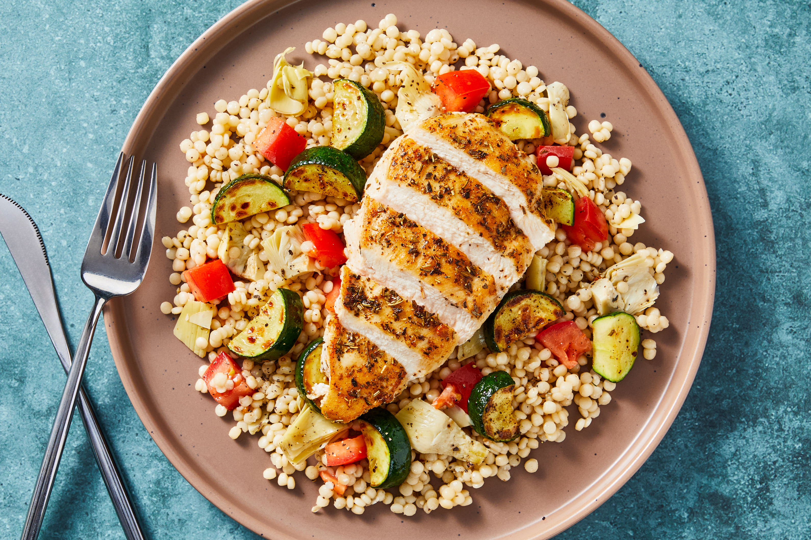 [SIDE VEG SWAP ZUCCHINI TO ASPARAGUS] Mediterranean Spiced Chicken with Tomato-Artichoke Couscous & Zucchini