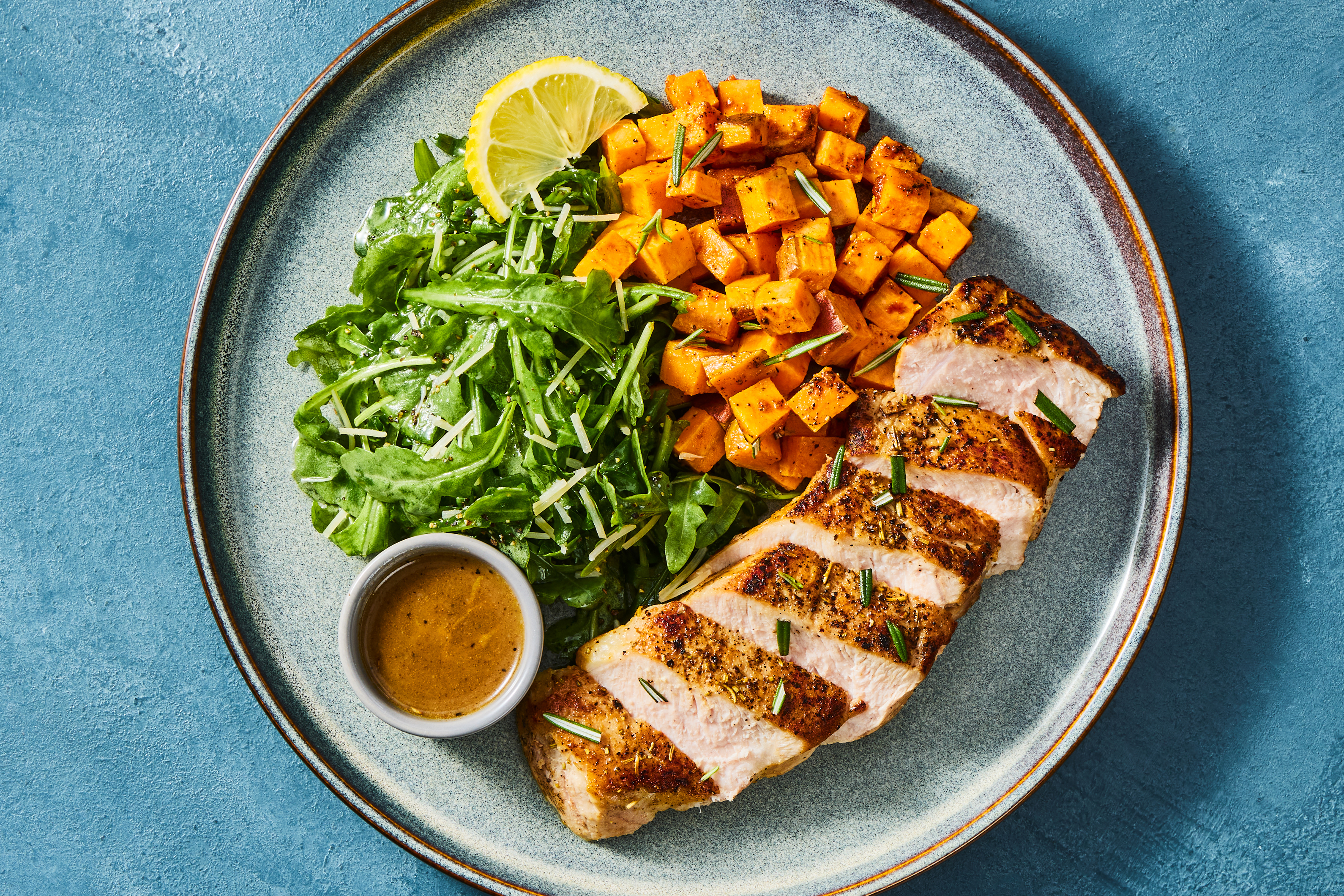 [SWAP PORK CHOPS TO CHICKEN CUTLETS] PNW only Compliant Garlic-Rosemary Pork Chops with Lemon Butter Sauce, Roasted Sweet Potatoes & Arugula Salad