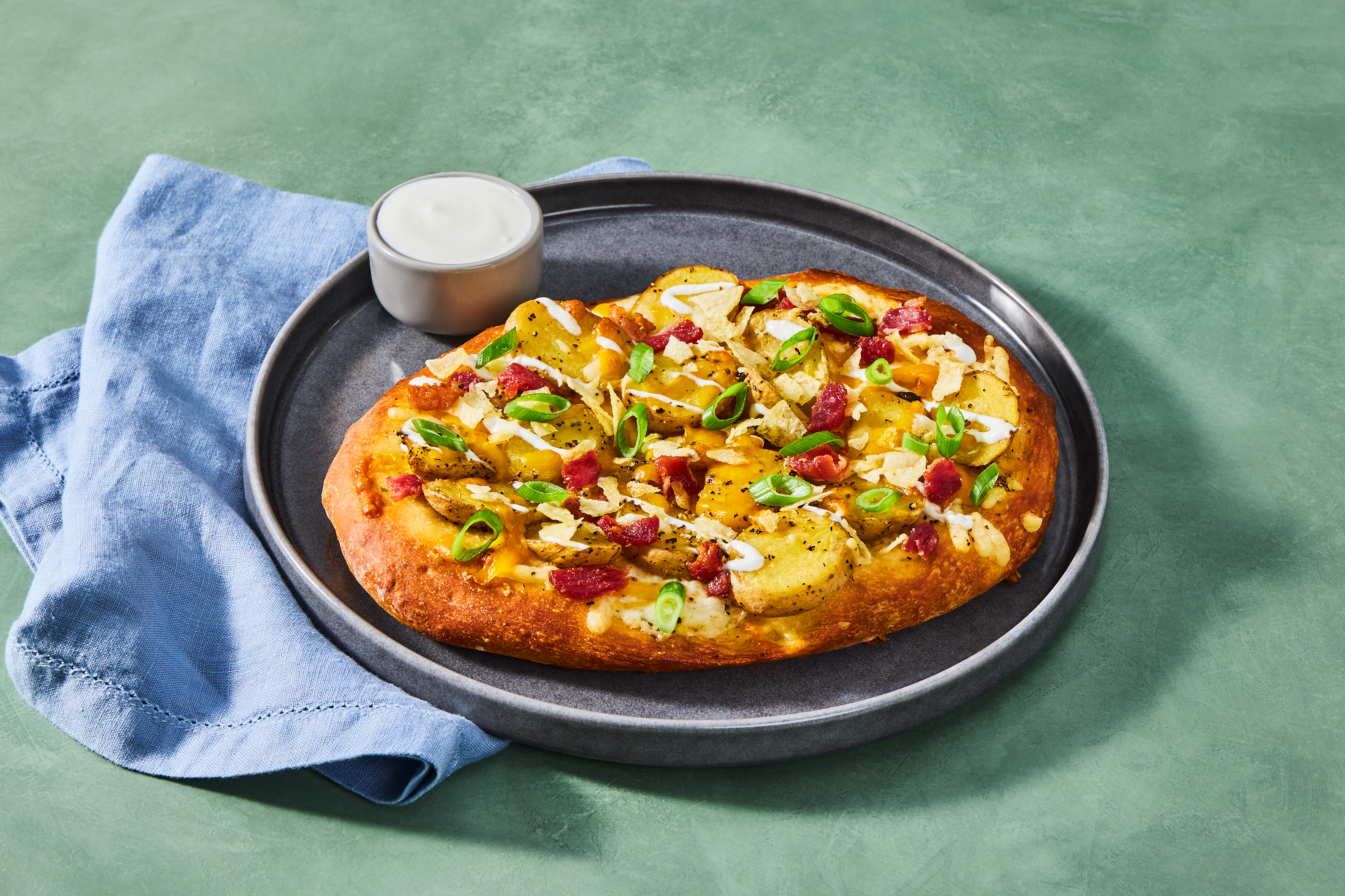 Compliant Loaded Baked Potato Pizza with Bacon, Cheddar, Sour Cream, Scallion & Potato Chip Topping