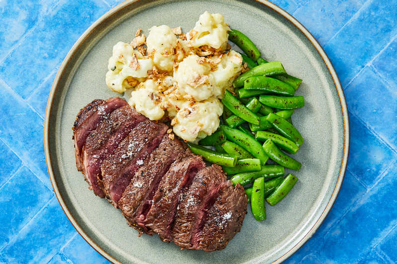 Pan-Seared Ribeye Steaks with Cheesy Cauliflower
