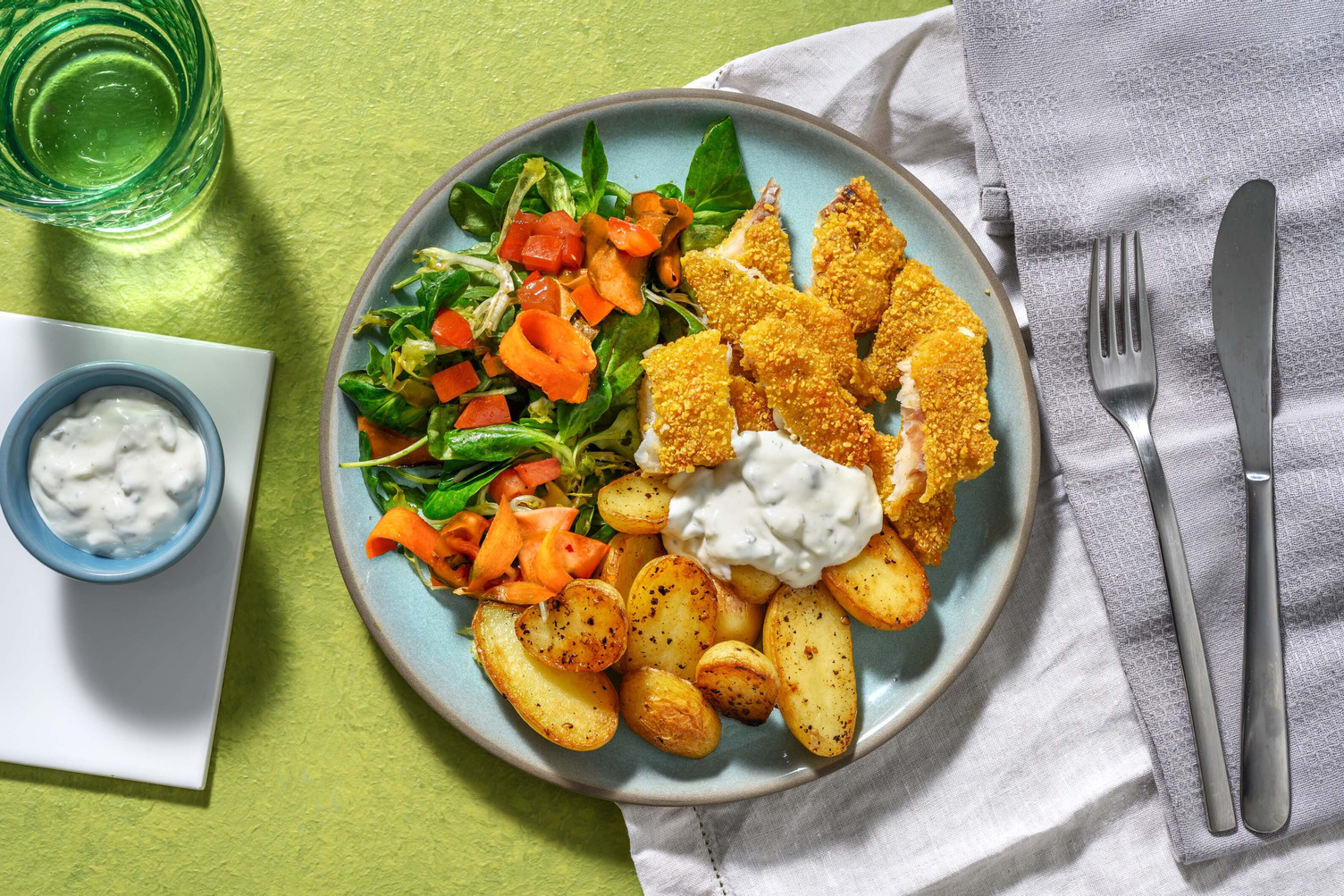 Merlu pané aux corn flakes et grenailles poêlées