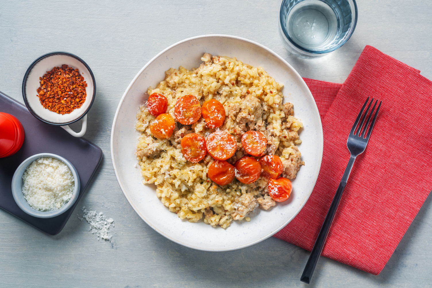 Risotto fondente alla salsiccia e pomodorini