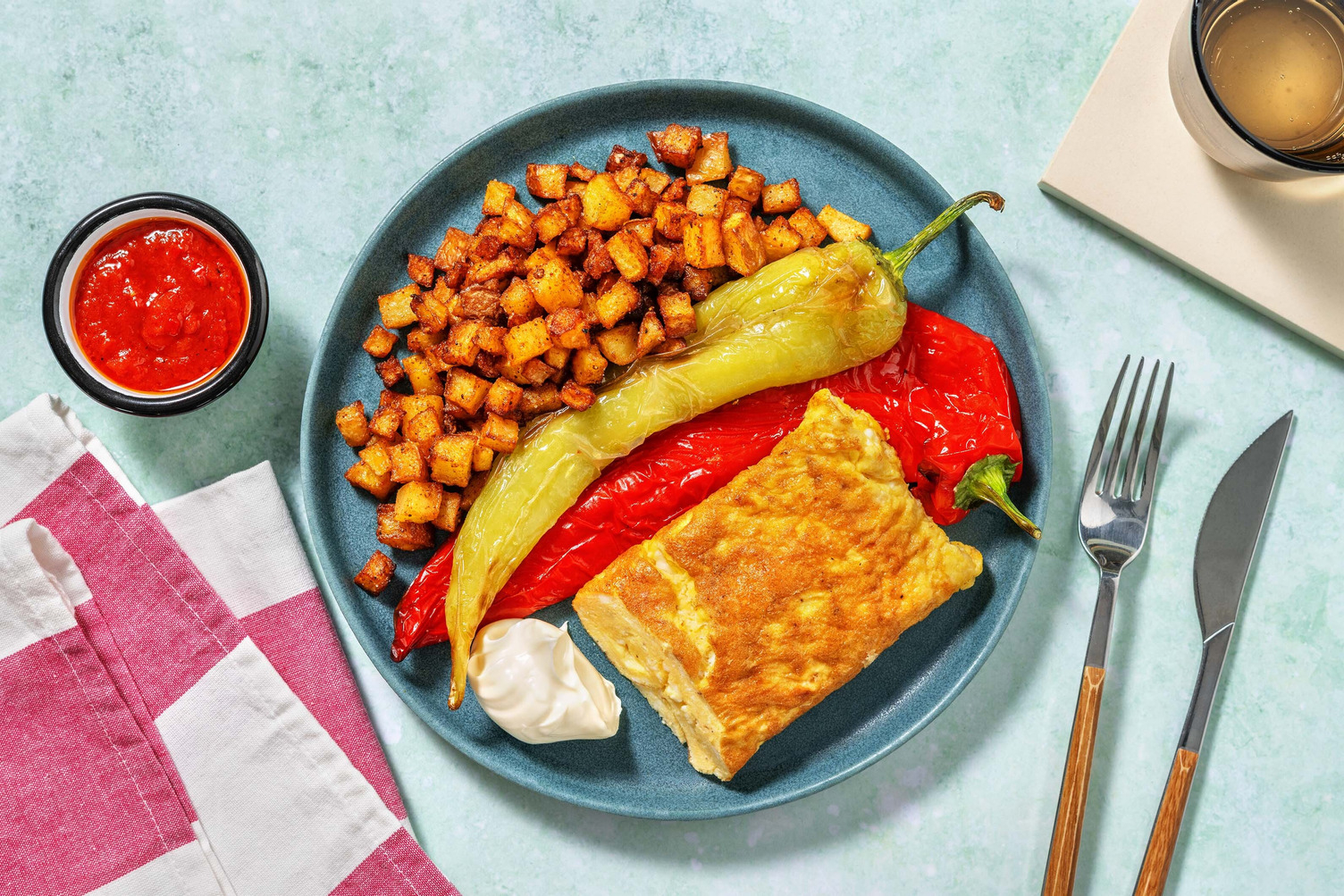 Omelette with Patatas Bravas and Tomato Sauce