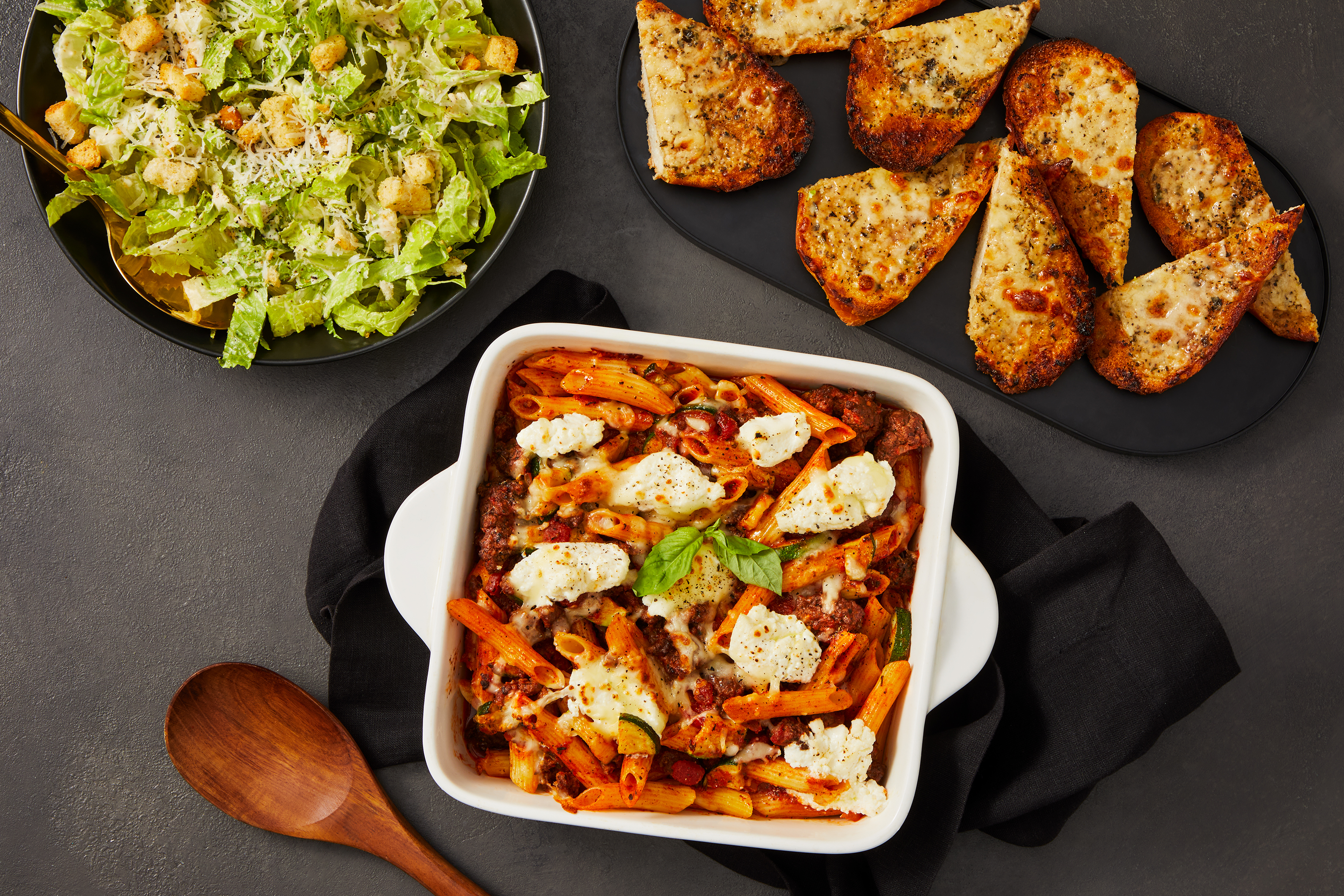 [PROTEIN DOUBLE GROUND BEEF] Family Feast: Beef & Zucchini Baked Penne, Cesar Salad, and Cheesy Garlic Bread