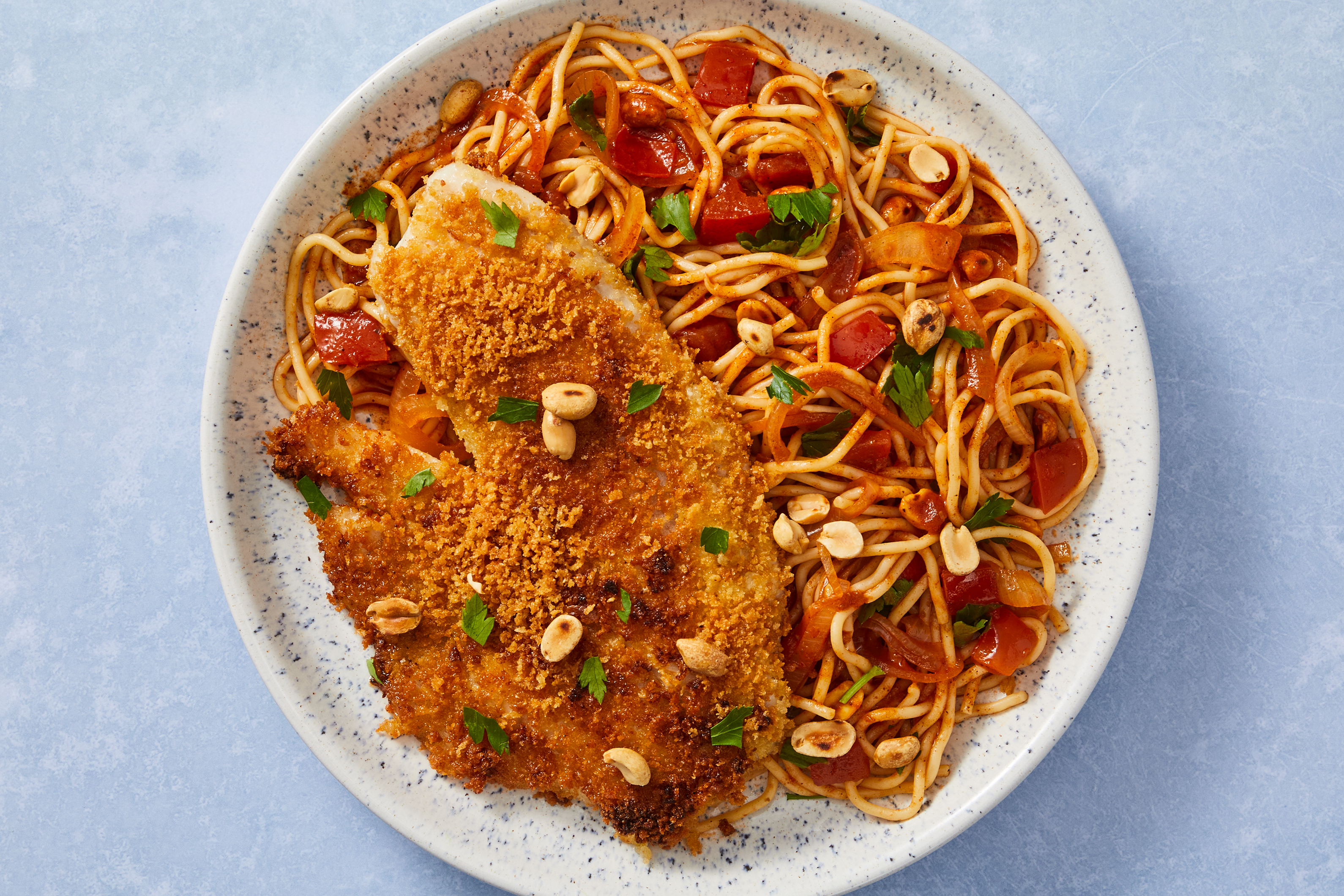 Crispy Tilapia over Senegalese-Style Spaghetti