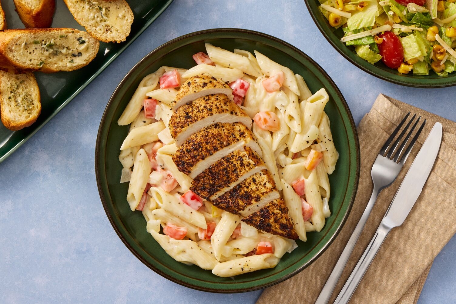 Creamy Cajun Organic Chicken Pasta & Garlic Bread