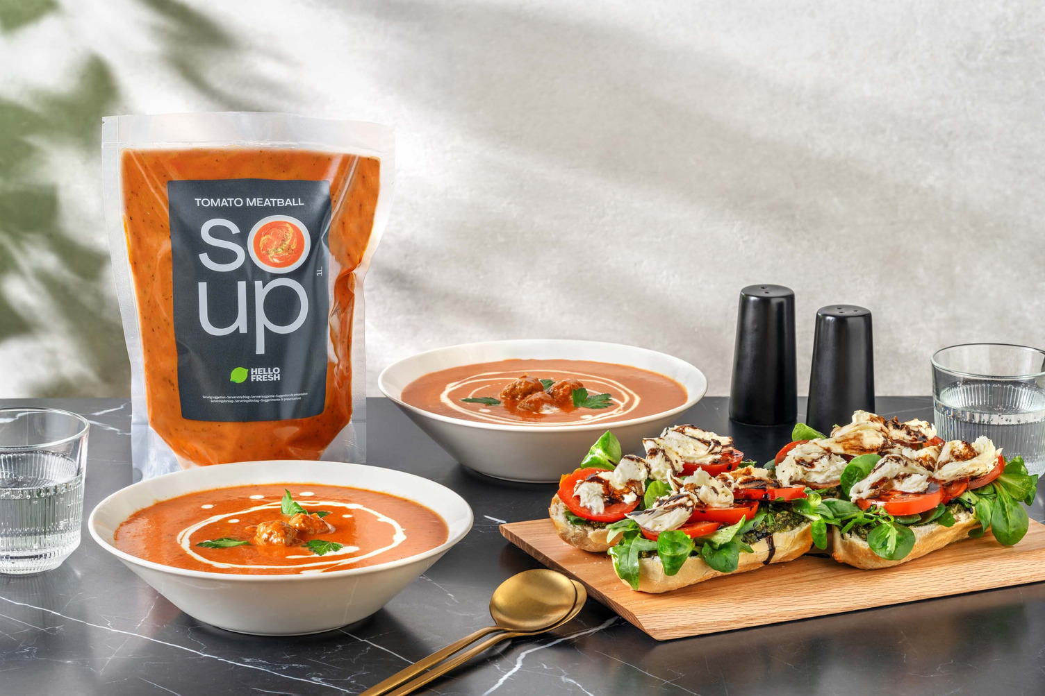 Fresh tomato soup with meatballs and baguette caprese 