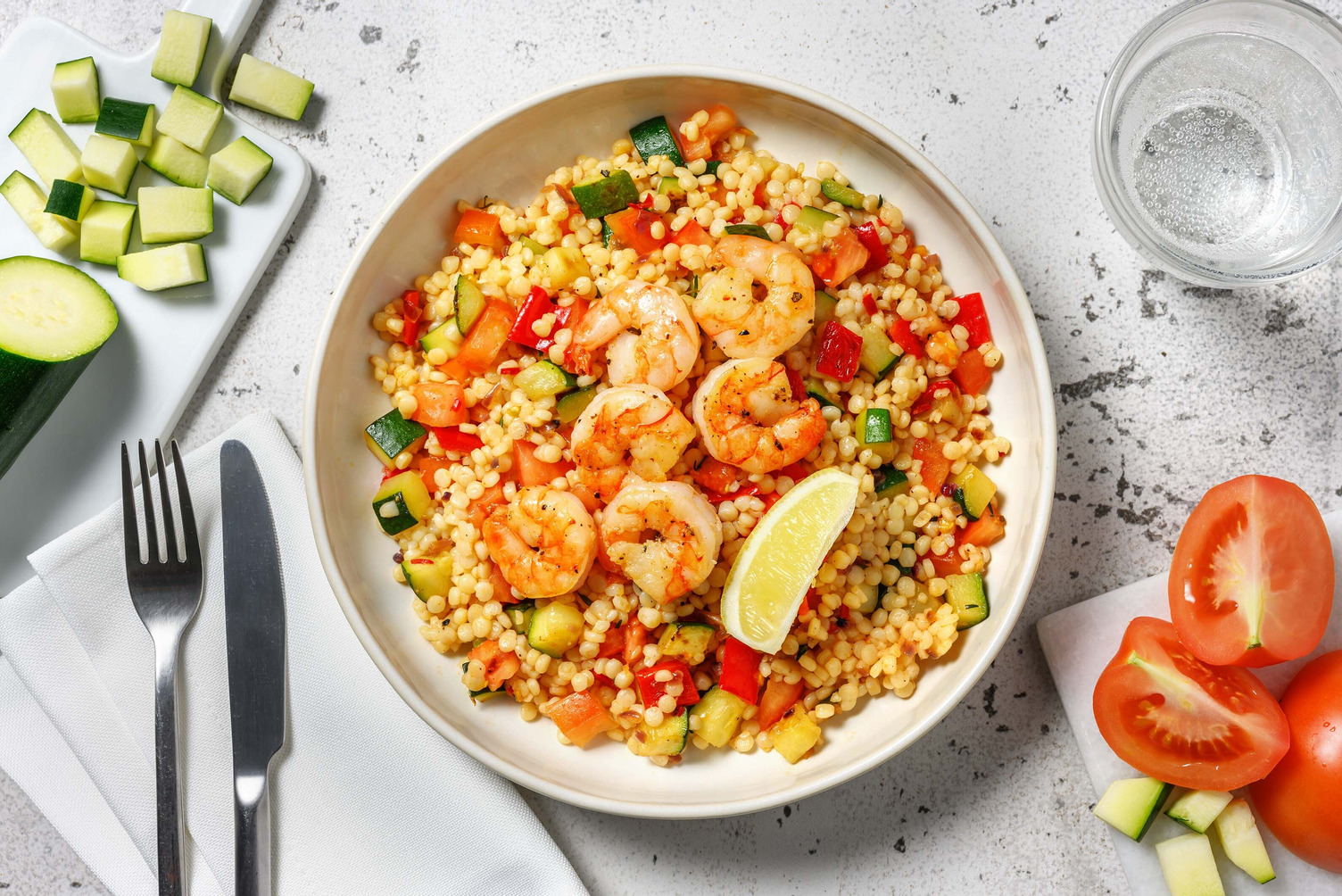 Crevettes sautées et couscous perlé parfumé