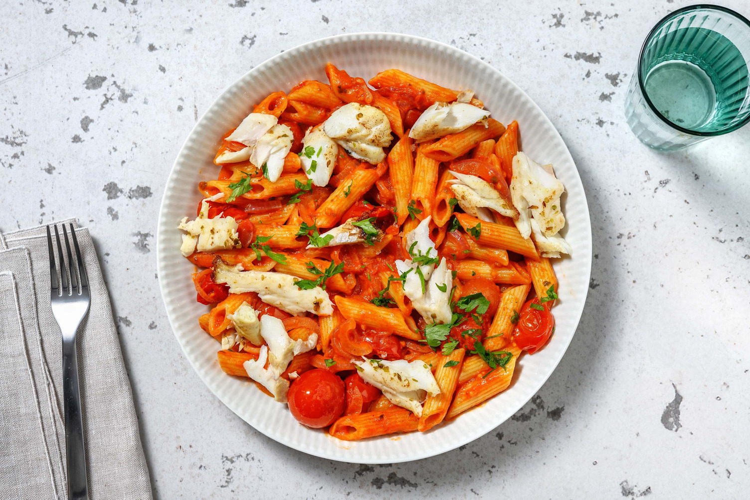 Penne met koolvis in mascarpone-kerstomatensaus