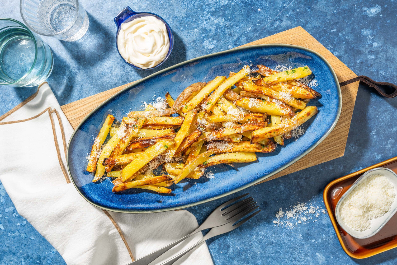 Pommes med persilja och ost