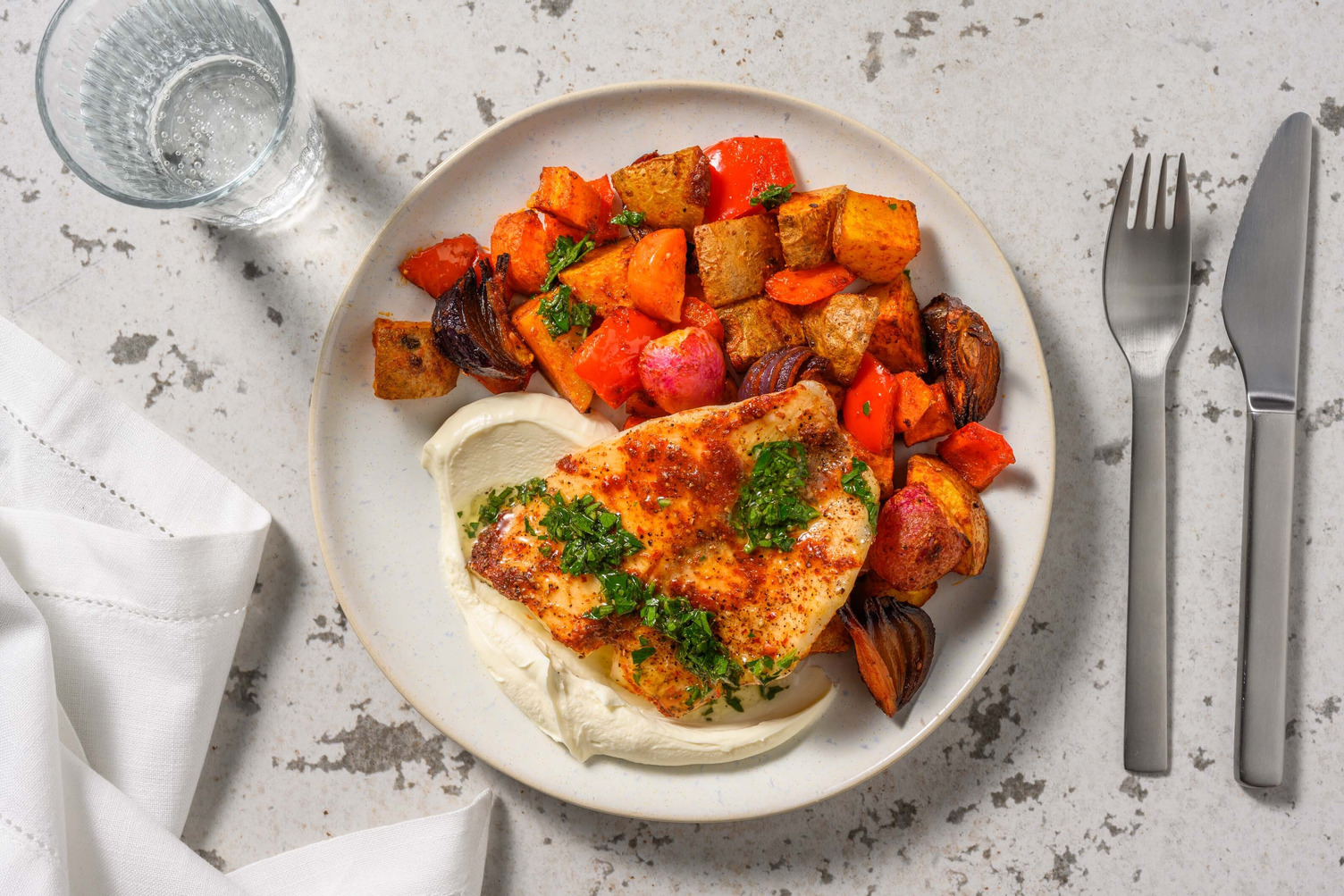 Harissa spiced haddock traybake