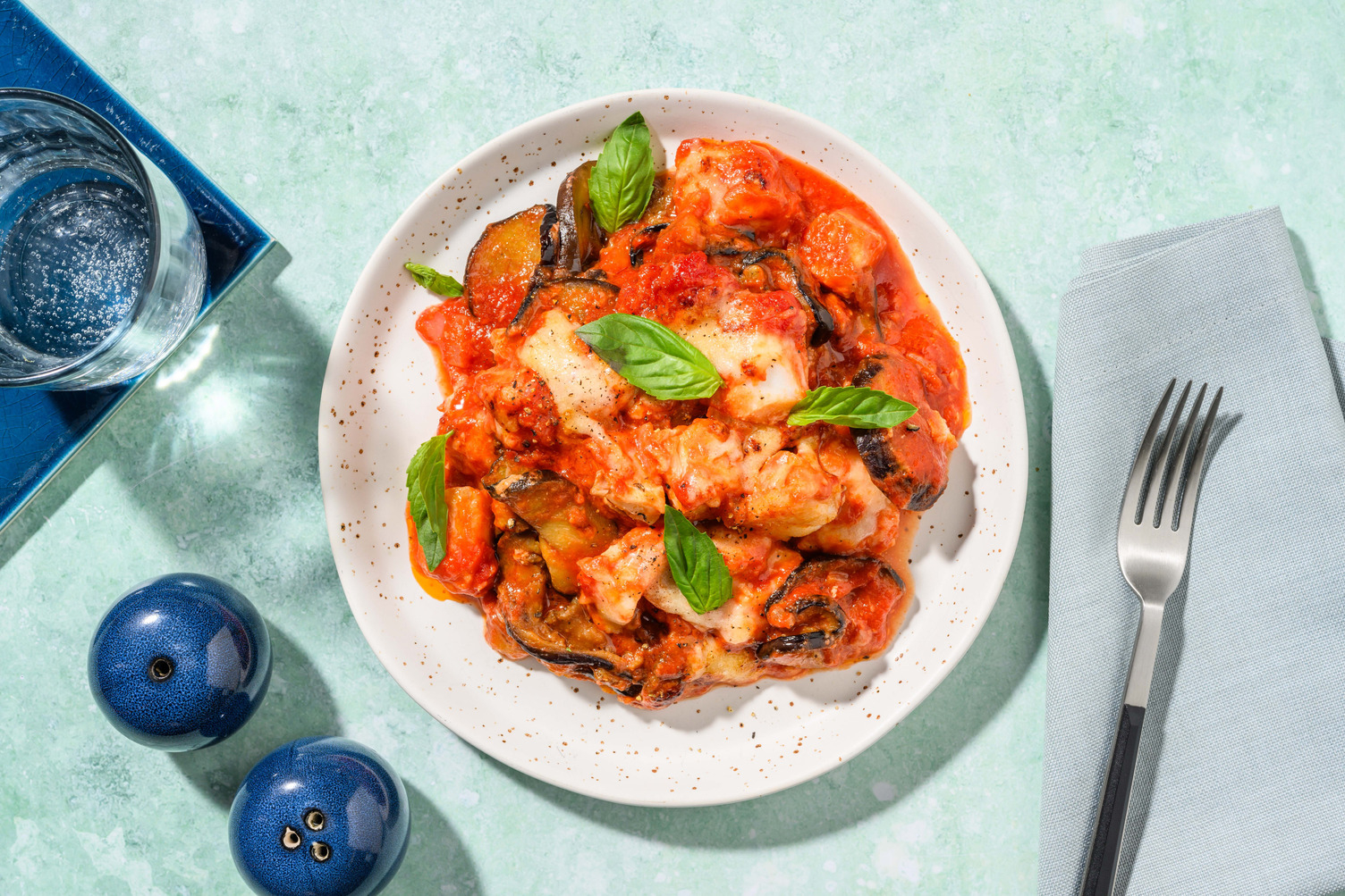 Parmigiana di merluzzo e melanzane fritte