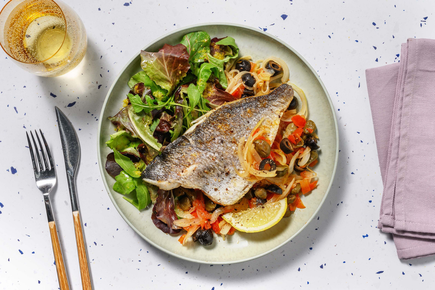 Filetto di branzino in umido all'acqua pazza