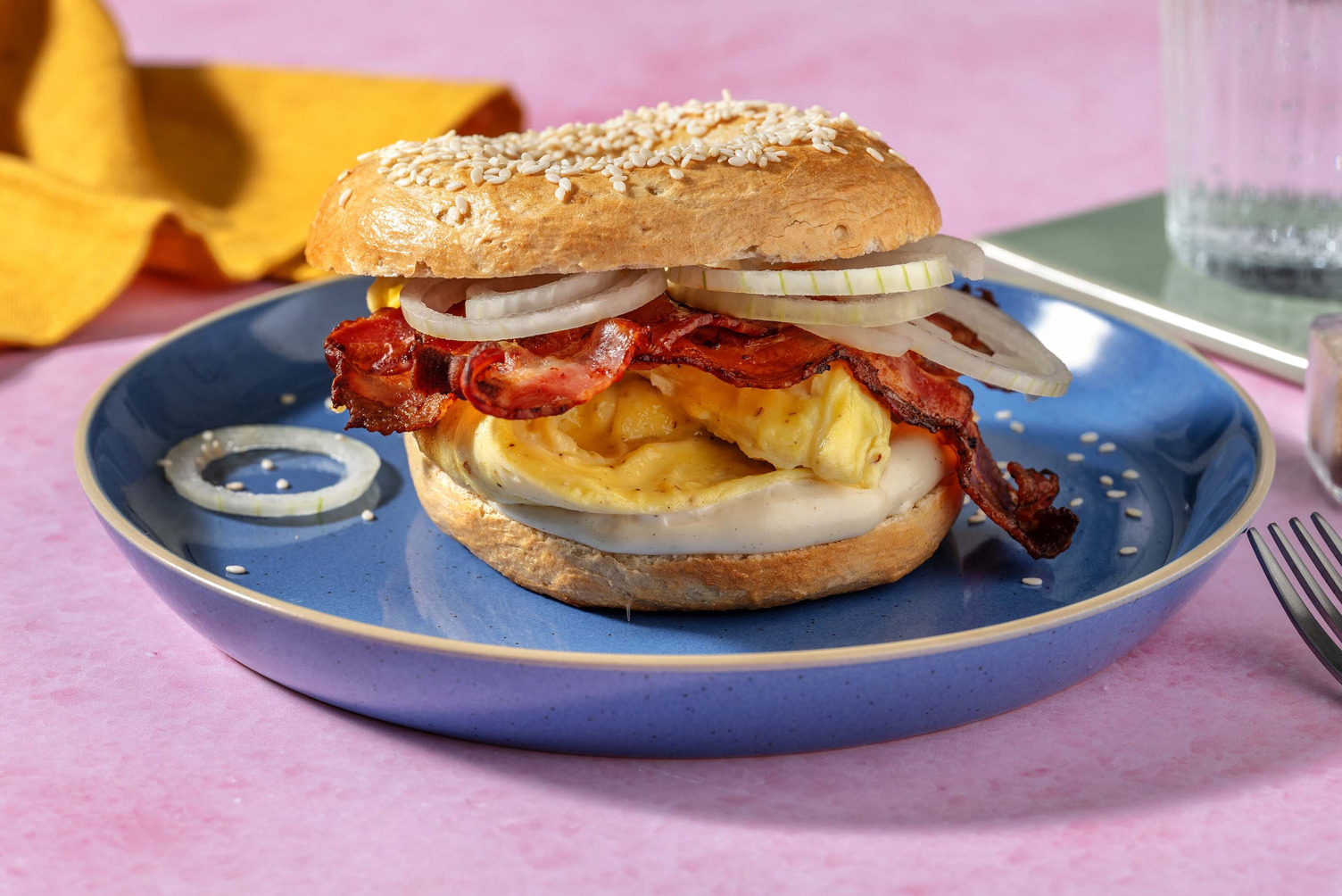 Scramble eggs bacon bagel
