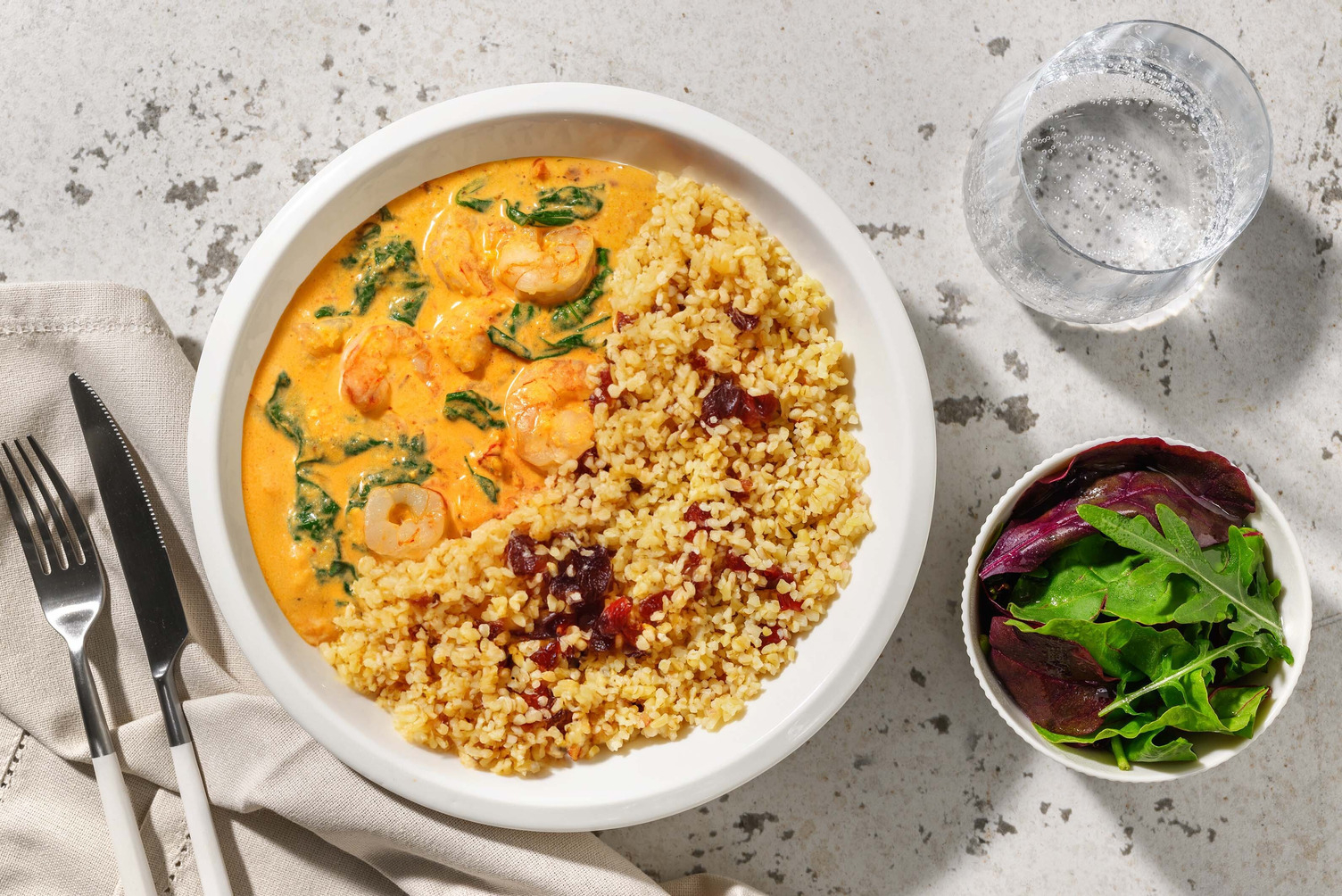 Harissa King Prawns on Cranberry Bulgur