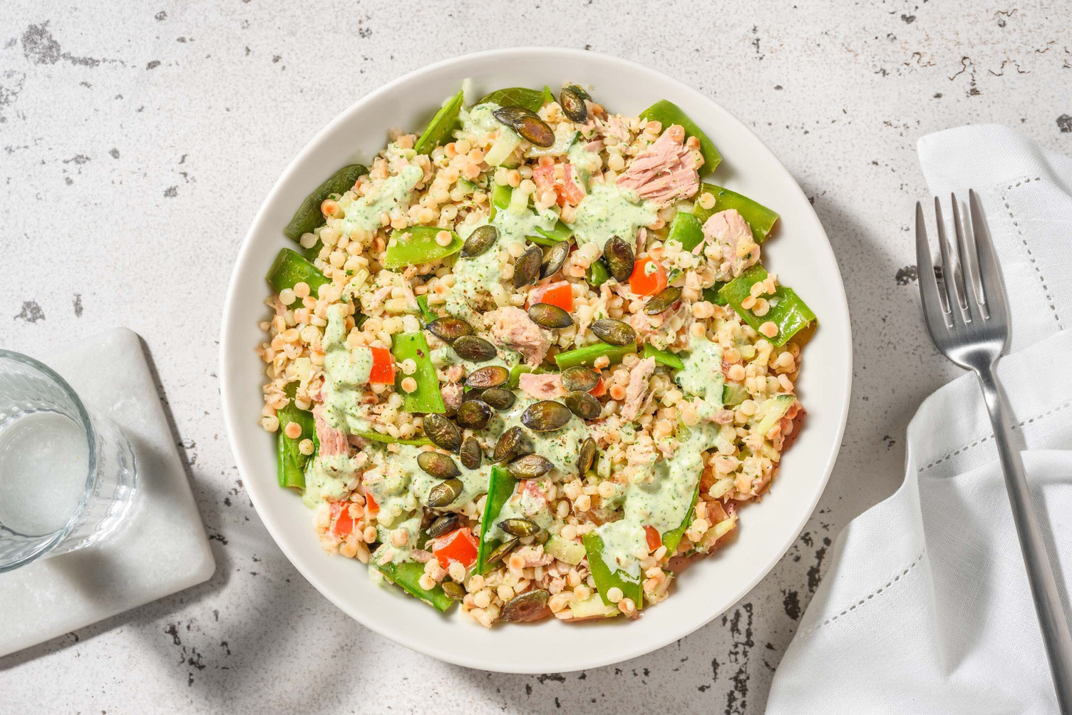 Groene couscous met tonijn en peultjes