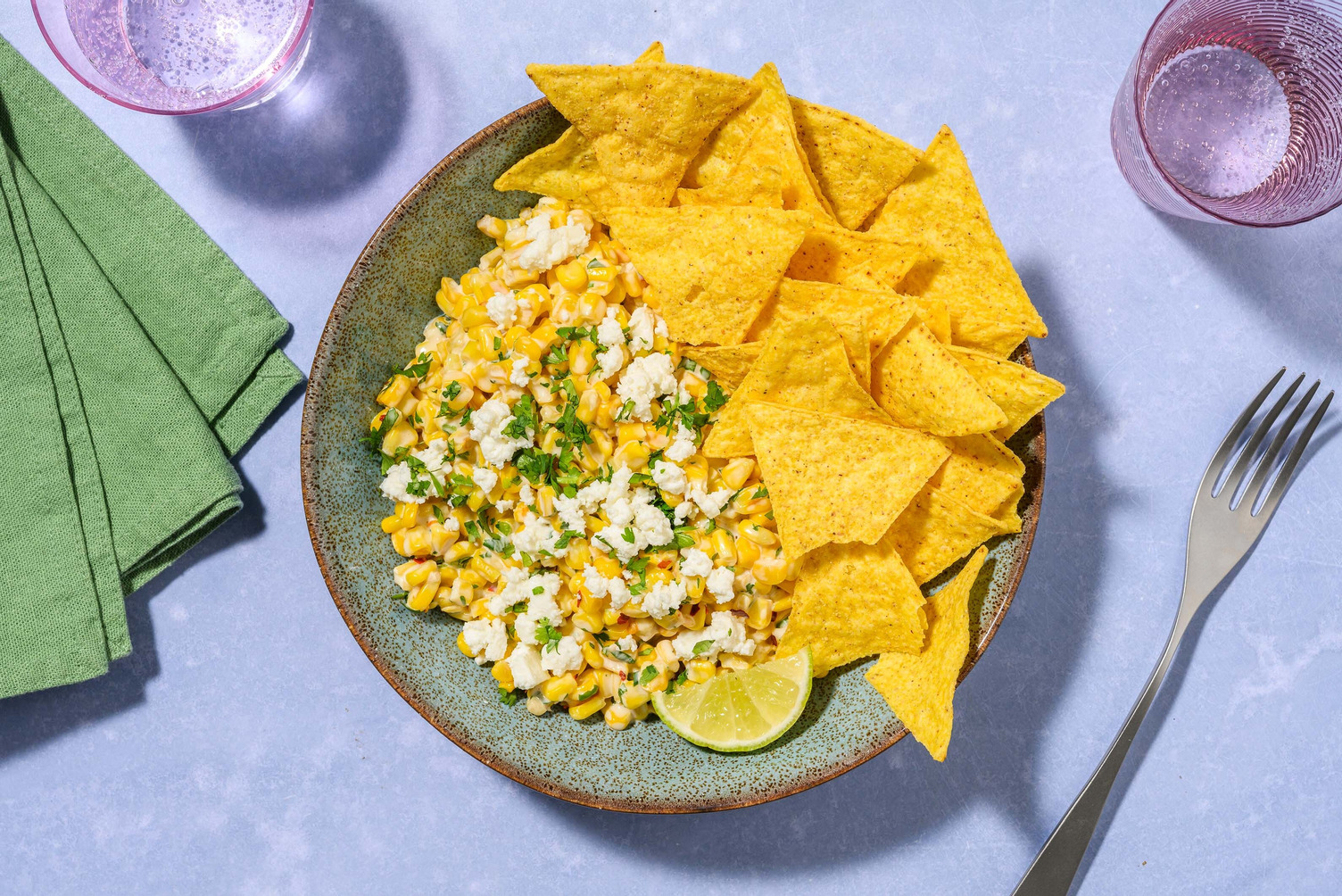 Elote style corn dip with tortilla chips
