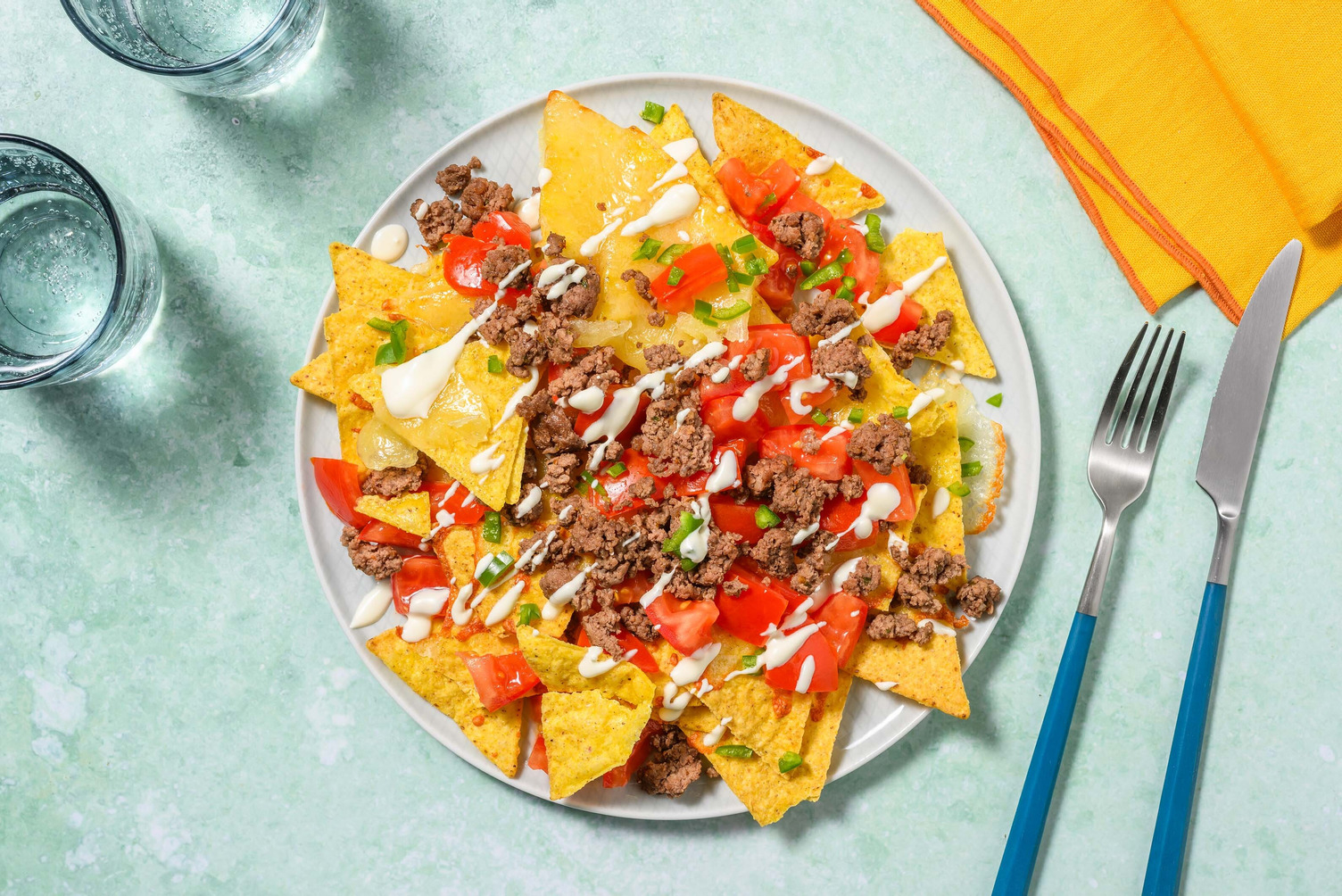 Osttoppade nachos con carne