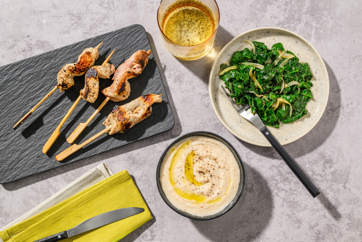 Arrosticini di maiale e spinaci filanti